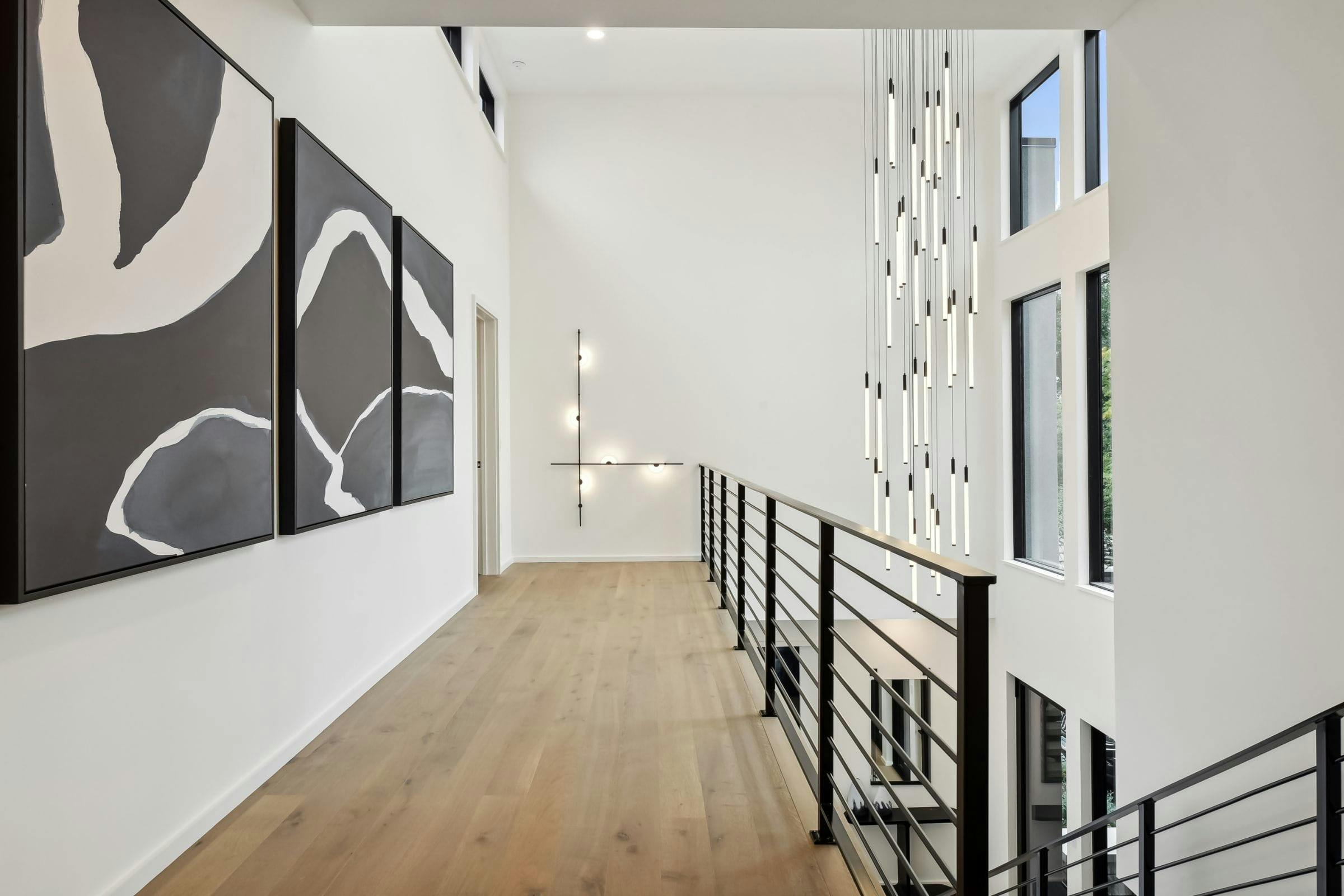 modern hallway in a home with a decorative wall light