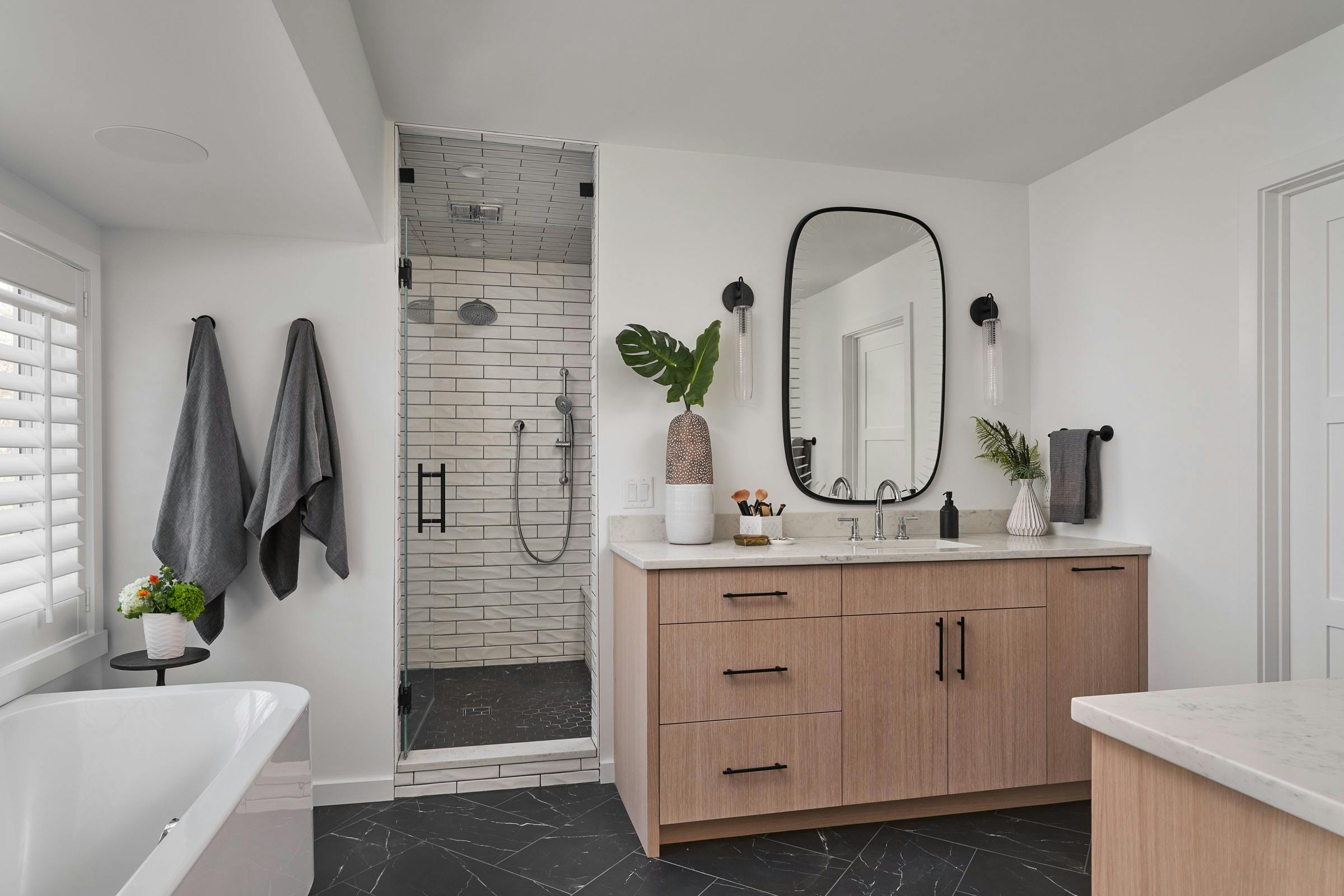 oak vanity, black and white bathroom 