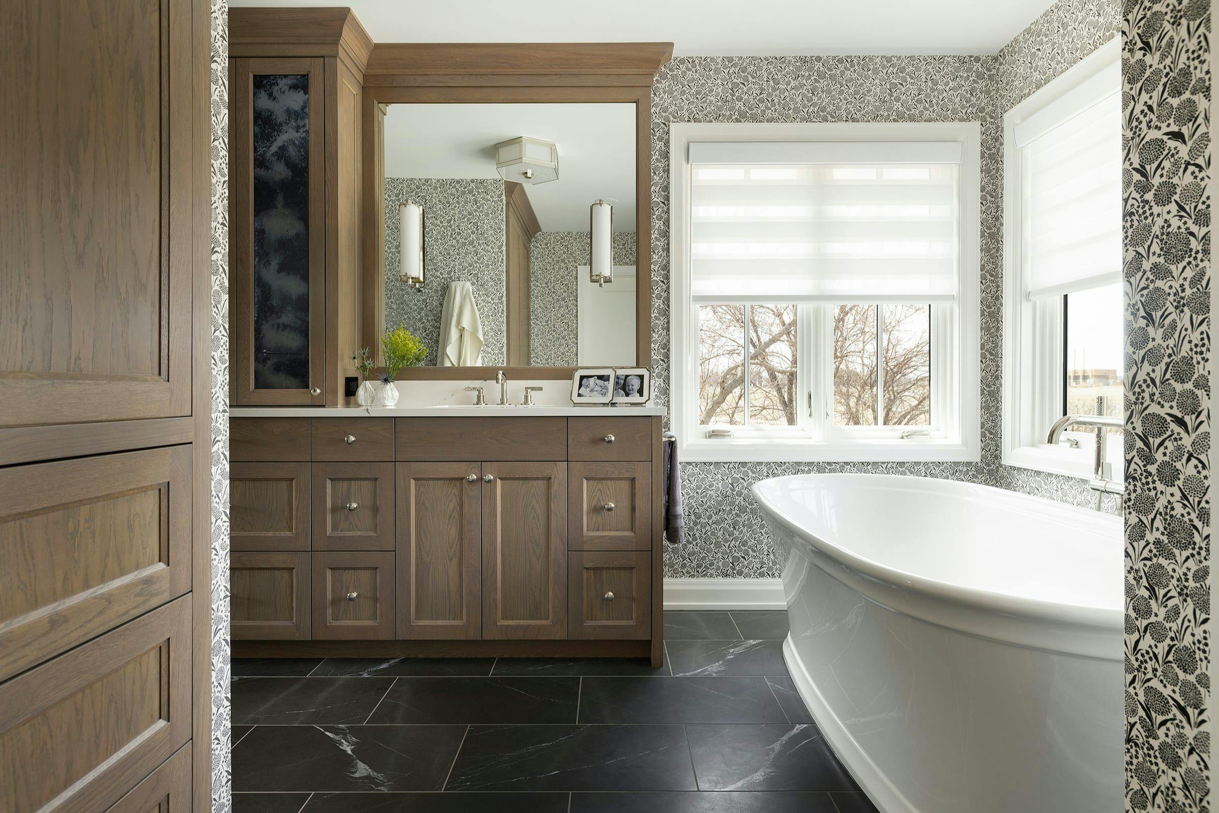 freestanding tub and vanity with antique mirror