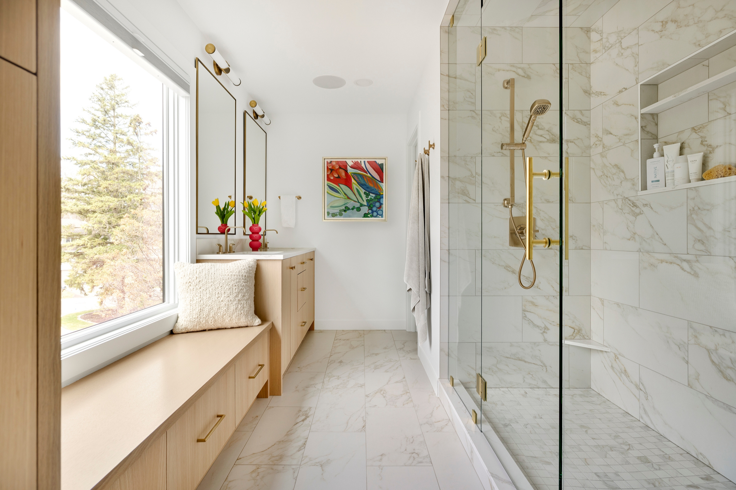 bright and airy owner's bathroom with large glass shower in Lake Minntonka, MN