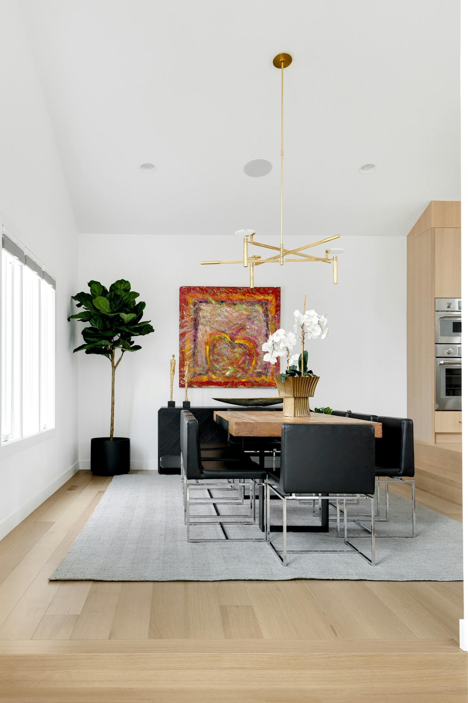 contemporary dining room with black chairs