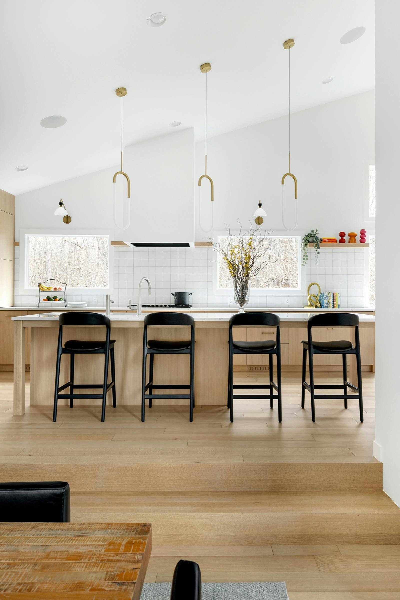 kitchen island with black stools