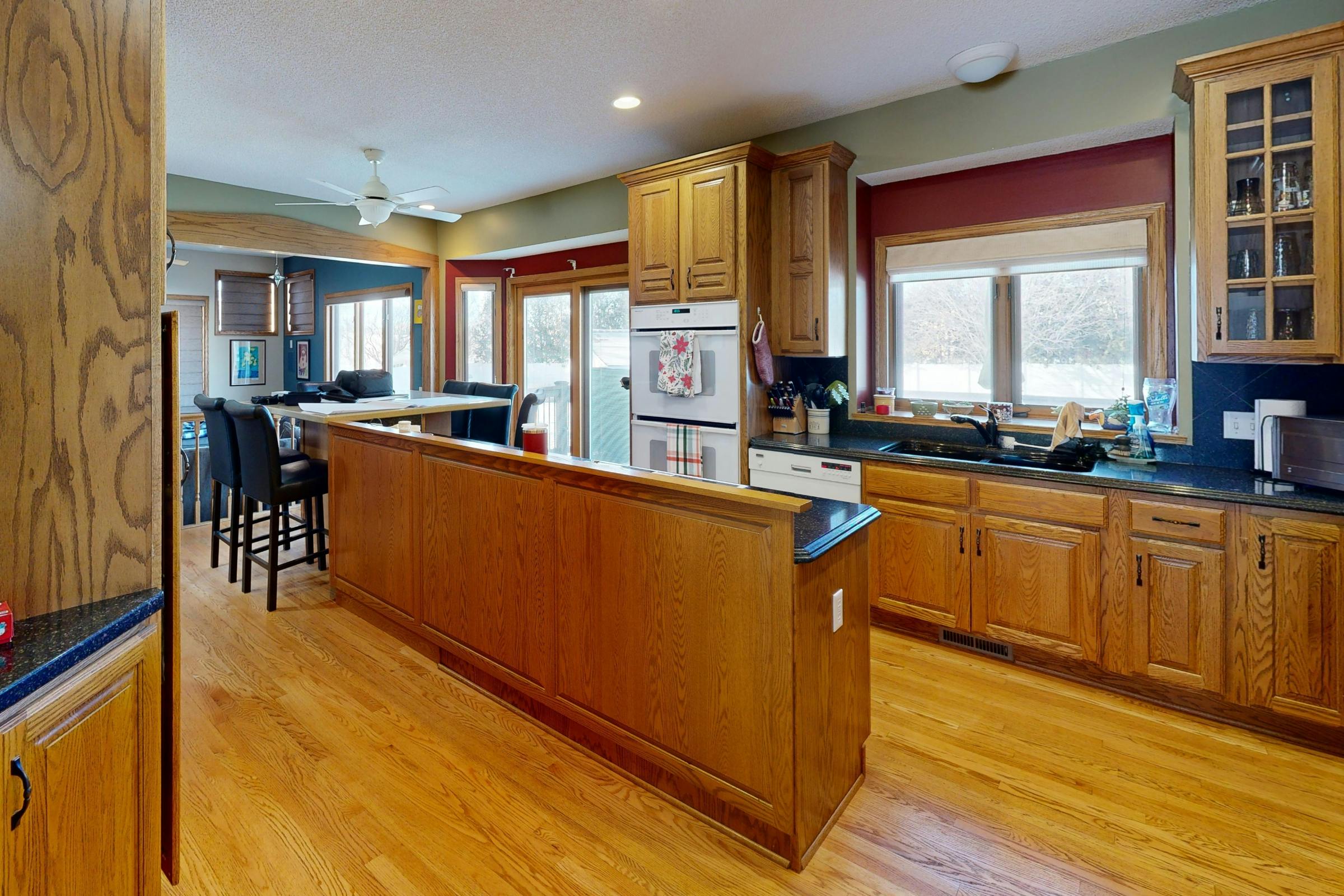 Before photo of galley-style kitchen with lower cabinets dividing the space and limited natural flow