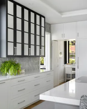 Black and white kitchen design with black frosted glass upper cabinets
