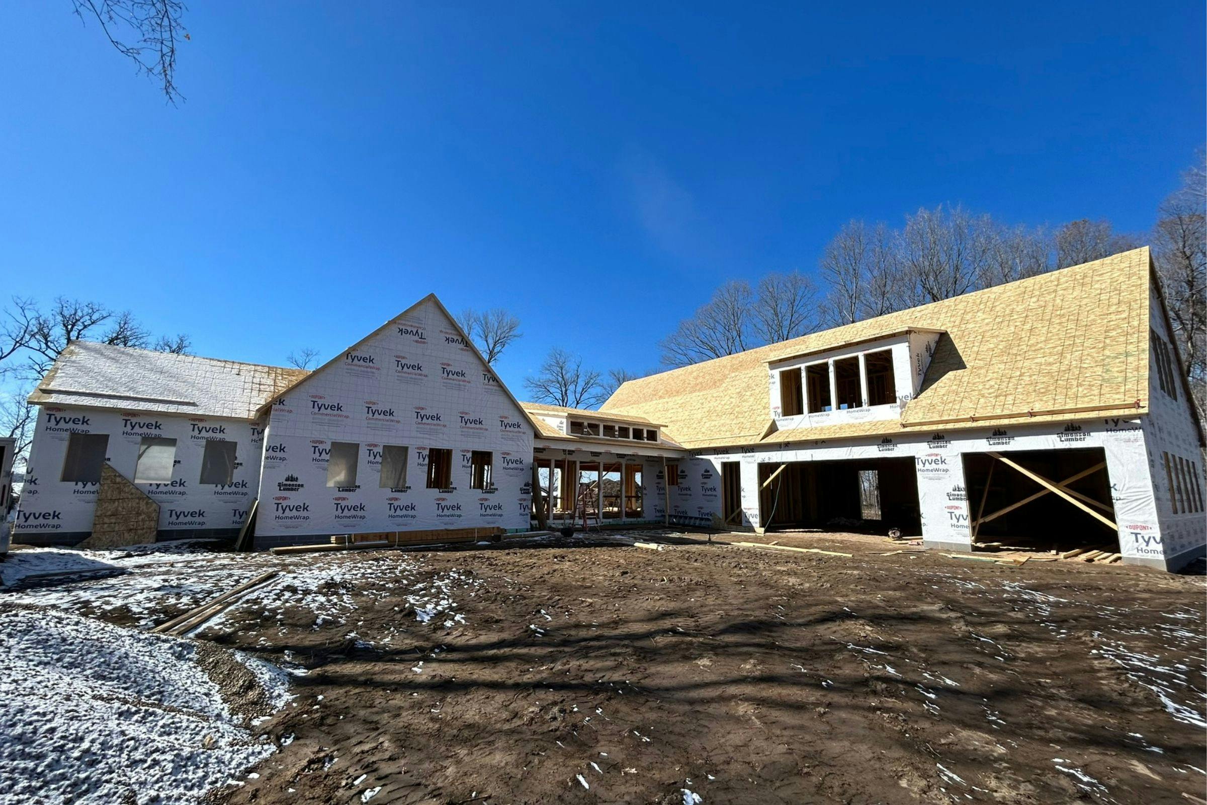 in progress exterior home in the framing and roofing stage