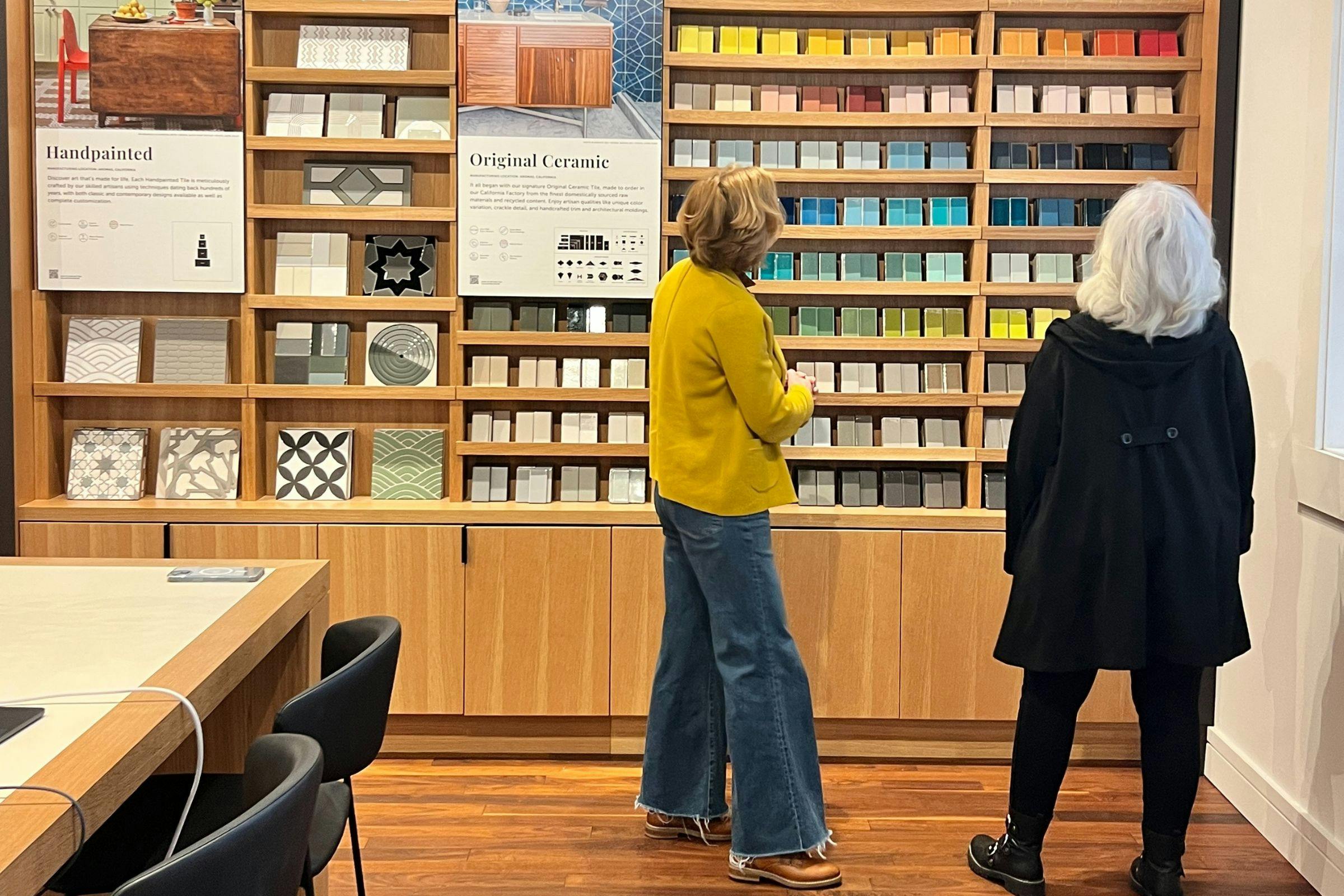 two women looking at tile in a local tile shop