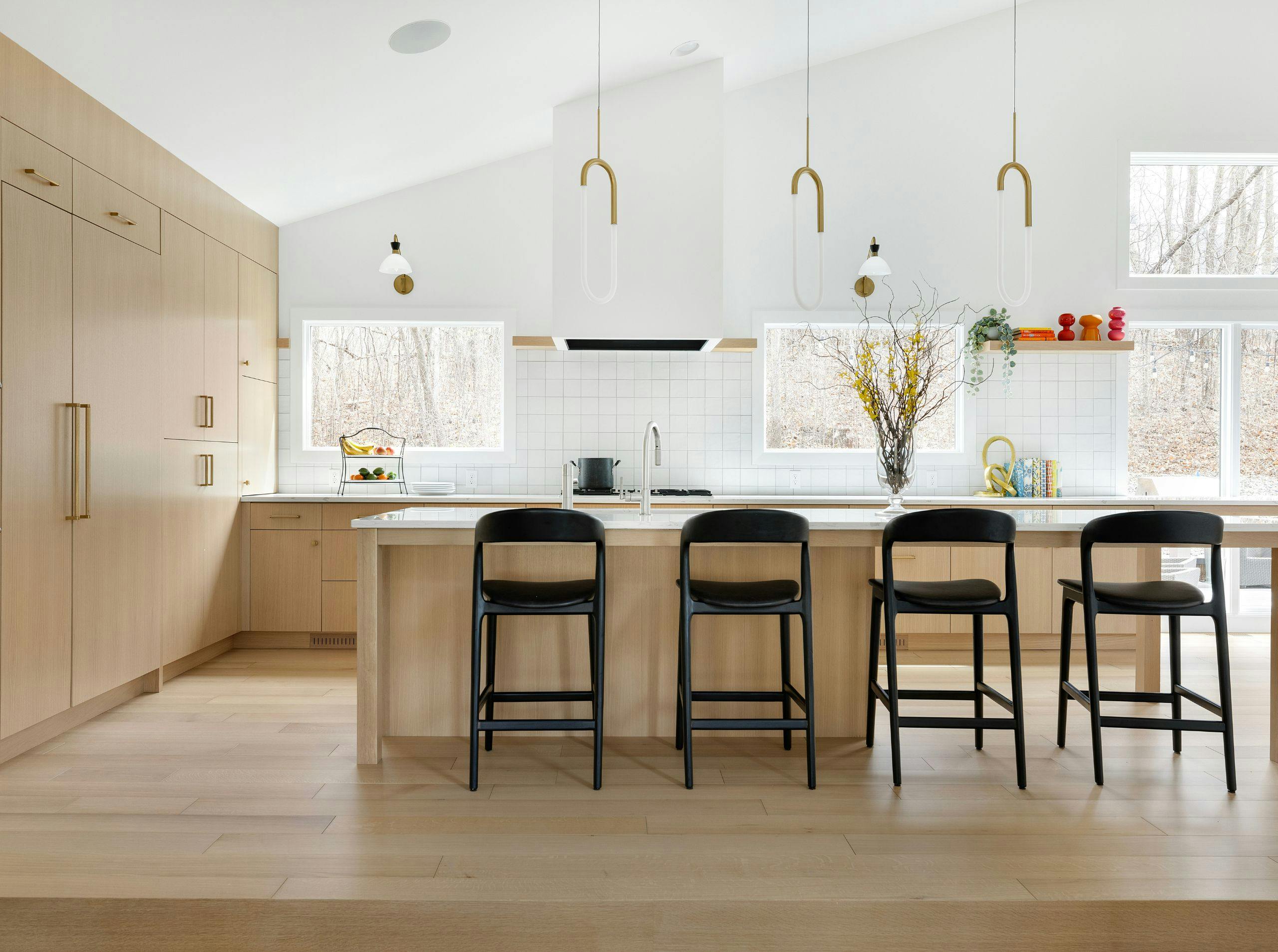 Reworked main-level layout in a Lake Minnetonka home balancing function and architectural detail