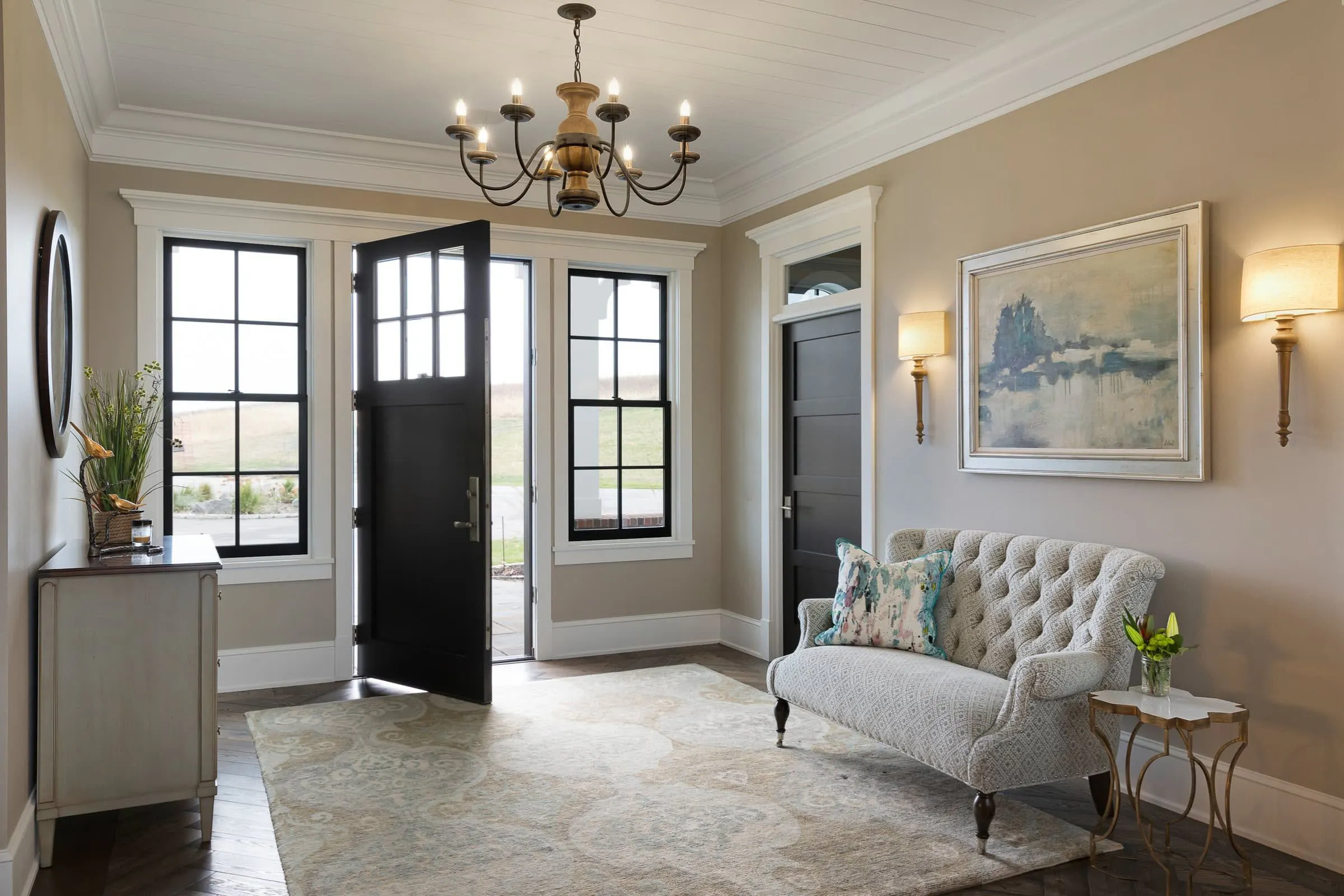 Entryway in a thoughtfully designed whole-home remodel with custom millwork and layered lighting.