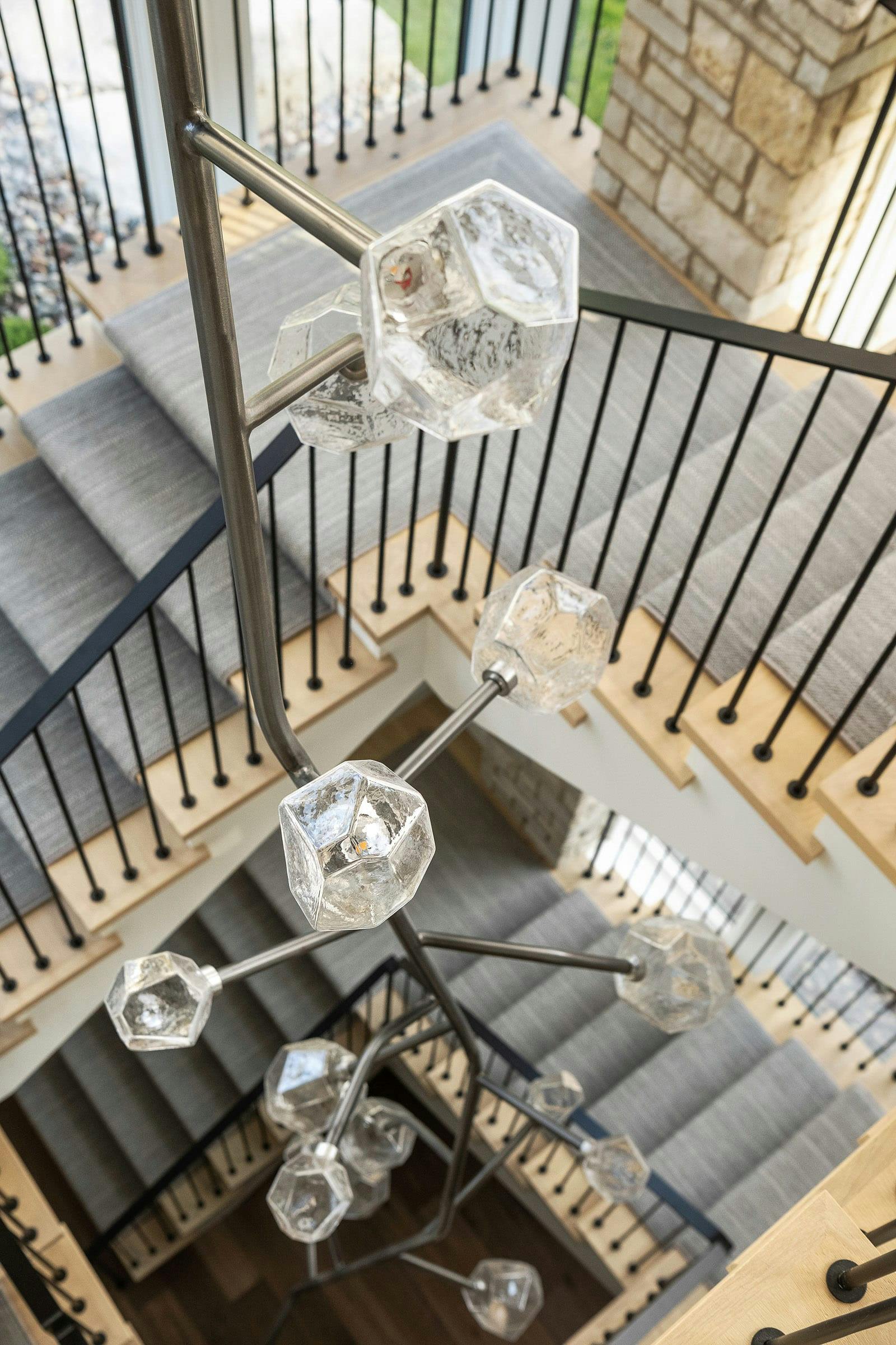 staircase with lights, windows