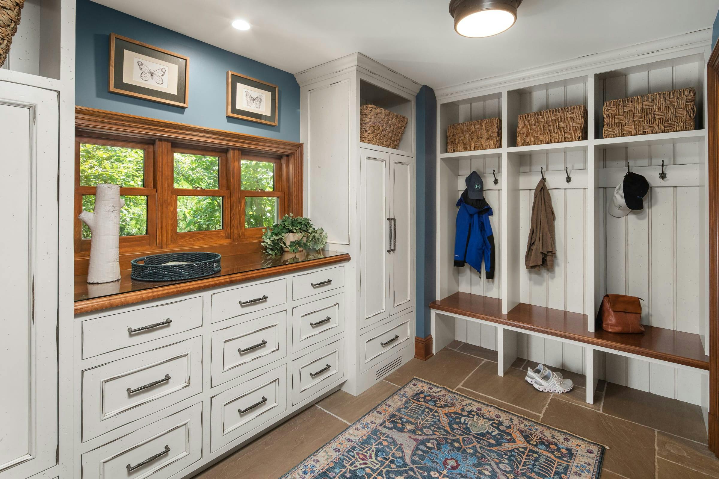 white, distressed mudroom, drawers, bench, hooks and storage