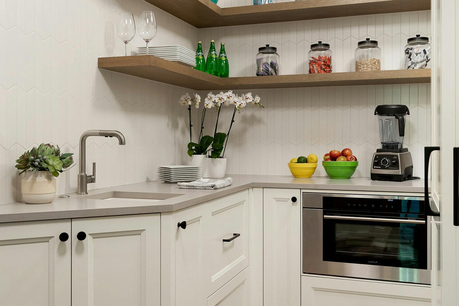 pantry with floating shelves, sink and additional appliances