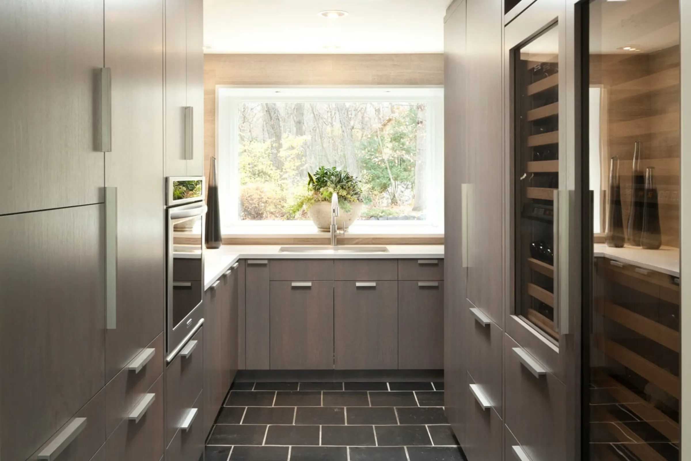 stainless steel and black walk in pantry design