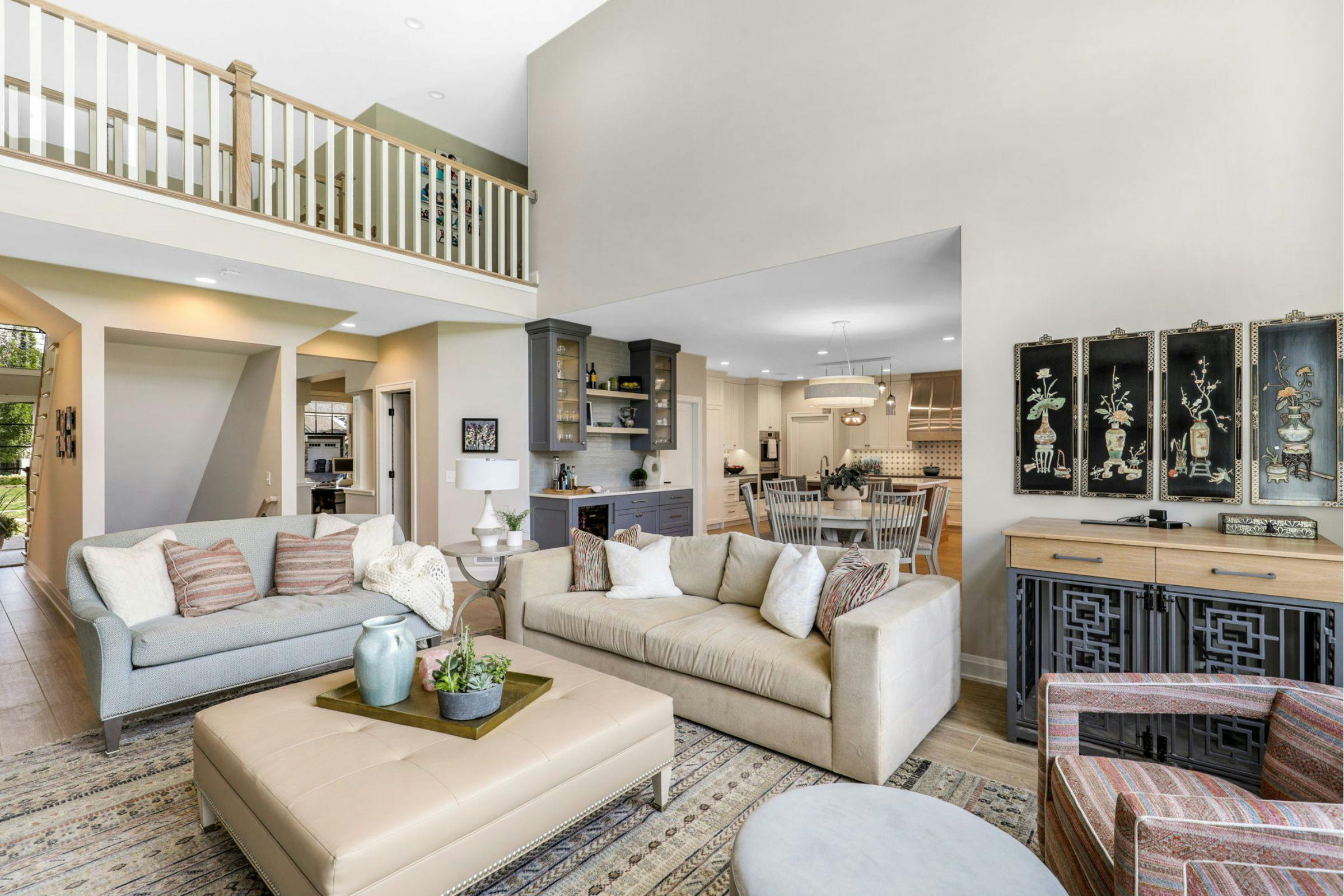 family room with sofas, kitchen in background