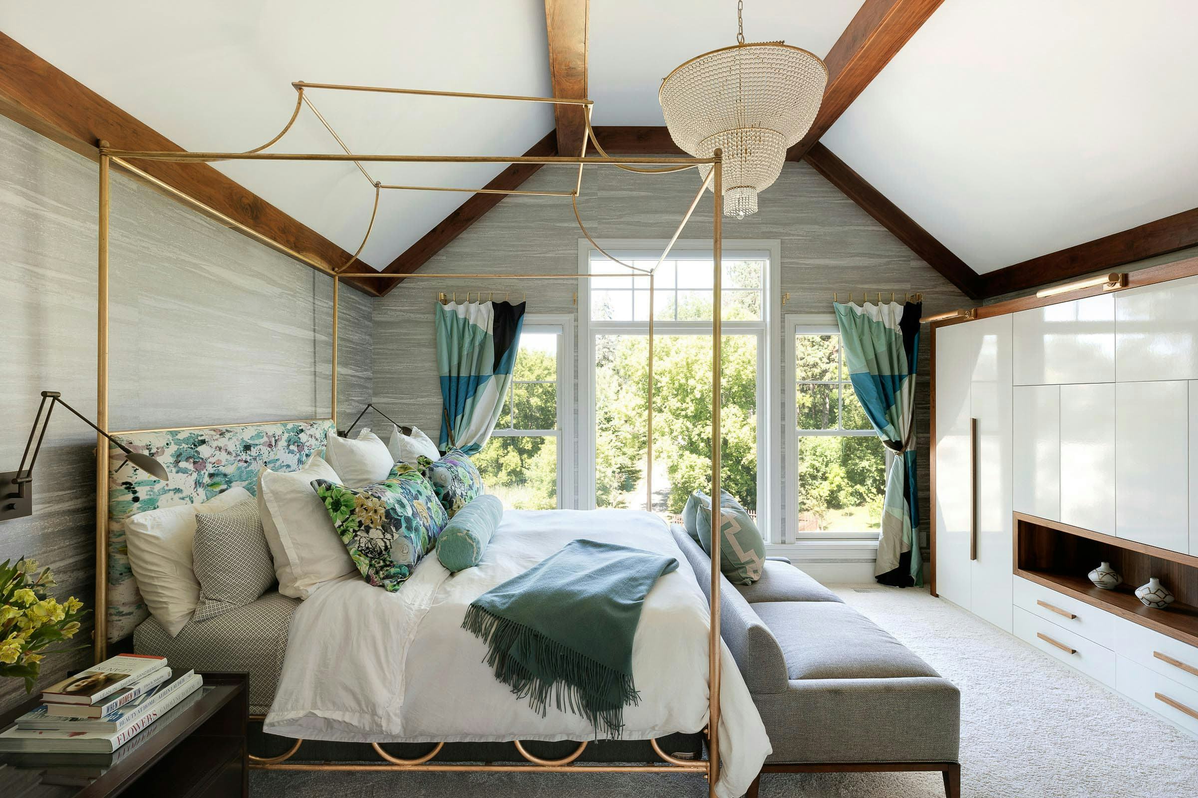 owner's bedroom, wood beams, custom built-in closet, gold bed post and chandelier 