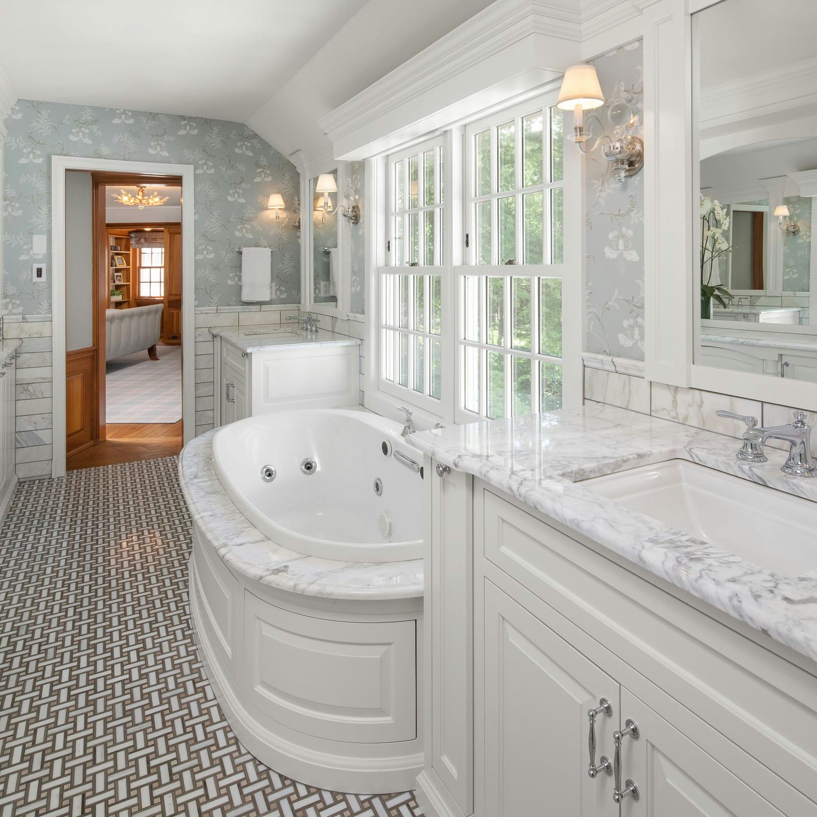 white and bright marble bathroom, vanity, jetted tub