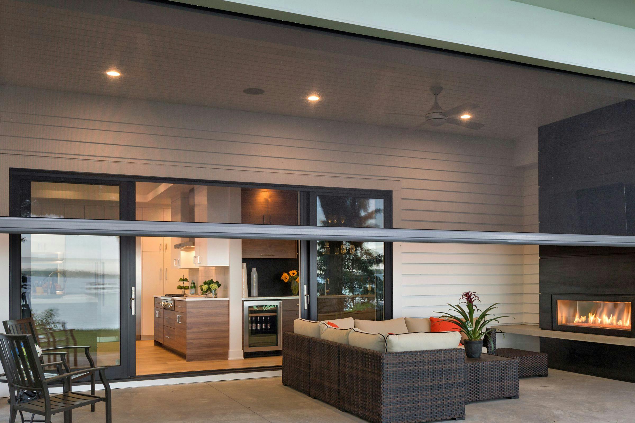 outdoor living space with screen half way pulled down