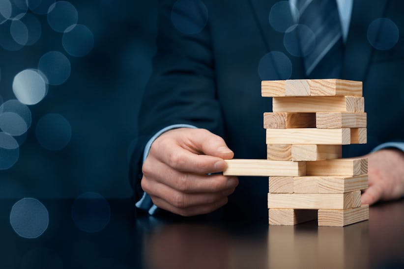 A man playing jenga towers