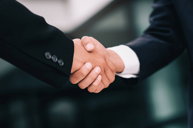 A picture of a men shaking hands