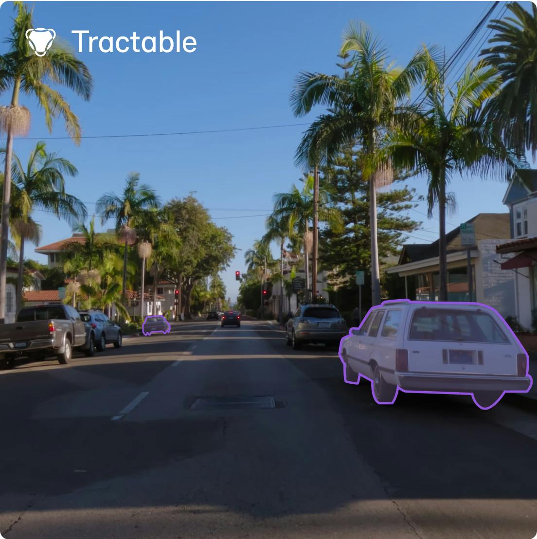 Tractable cover image, showing a boulevard with cars parked and labels over the two cars