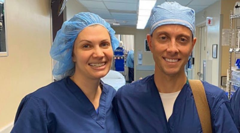 Dr Peled and her husband in surgical scrubs
