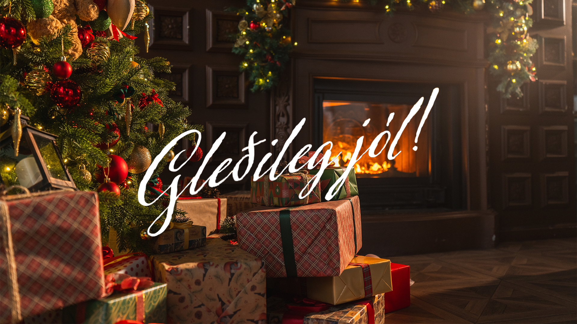 Á myndinni er jólatré, jólapakkar og á henni stendur Gleðileg jól