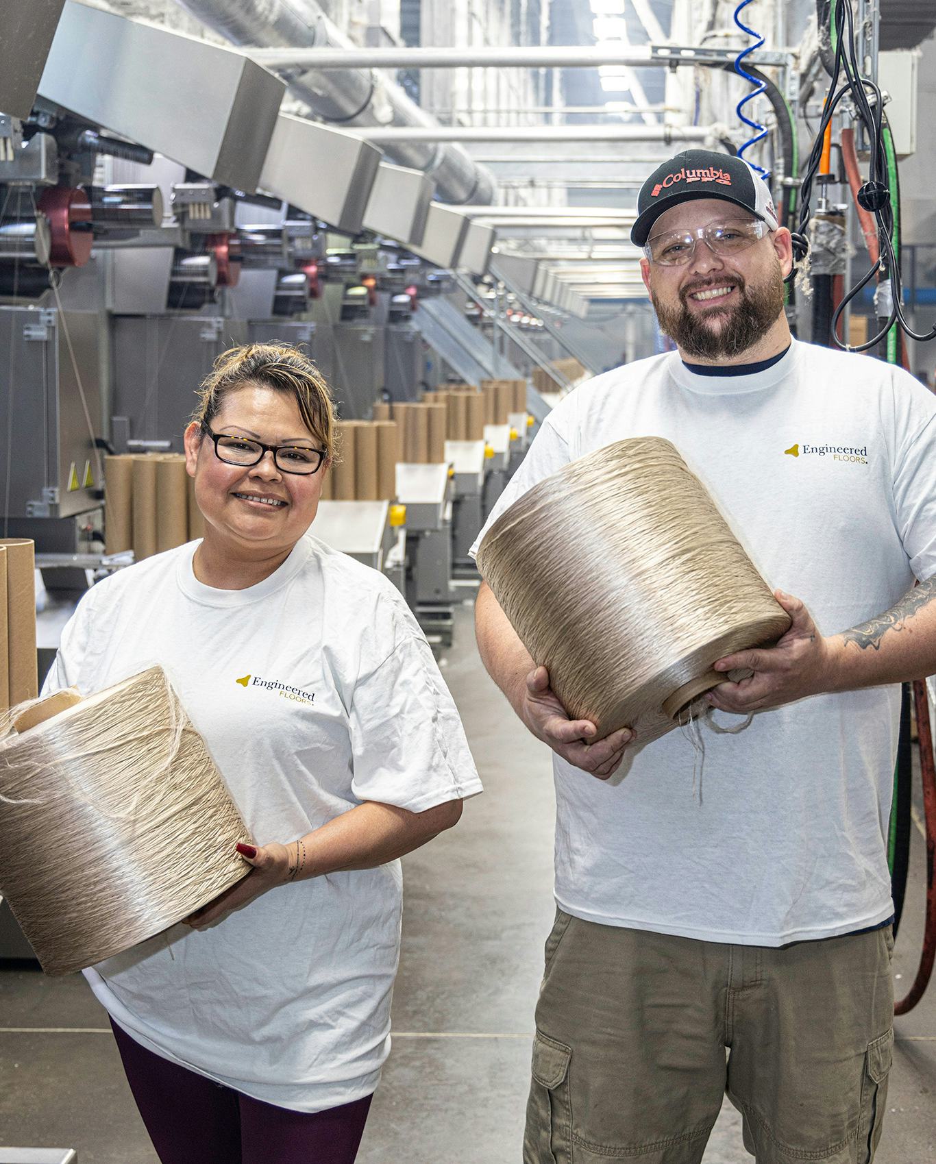 EF employees holding yarn