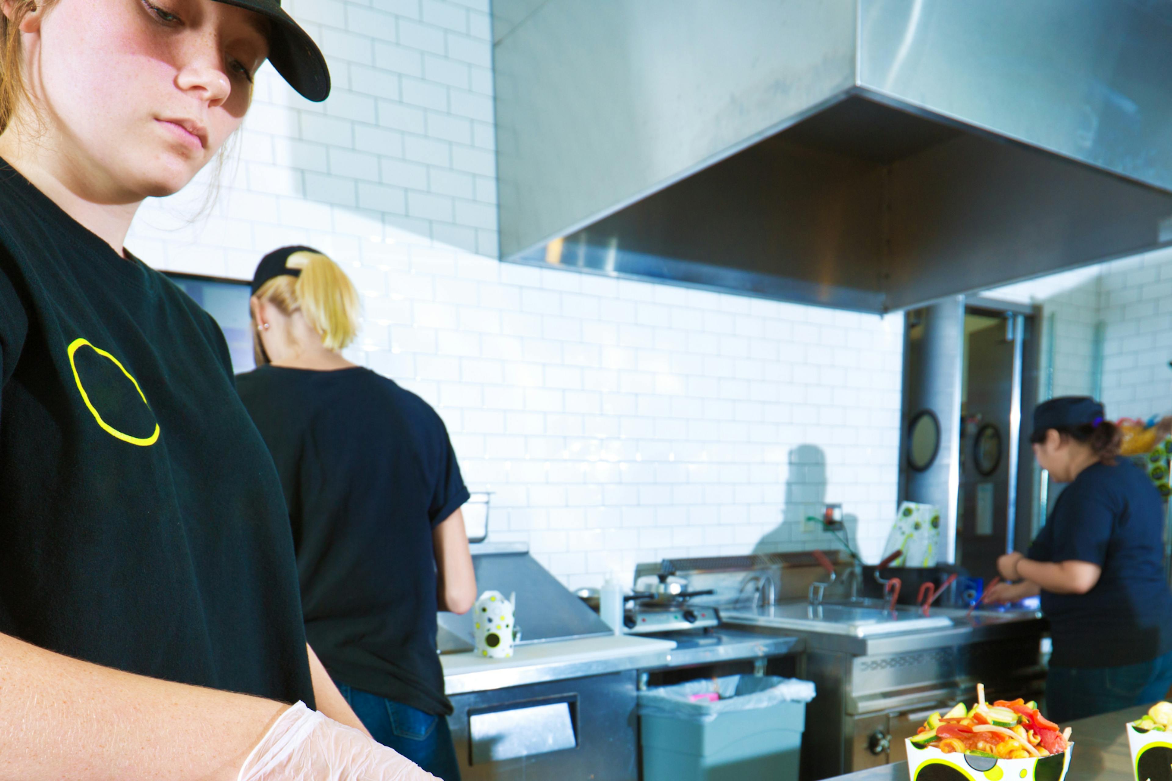 Three women working in a kitchen