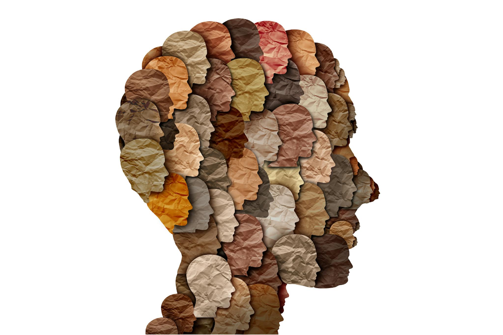 Outline of a head with smaller heads with shades of brown filling the space.