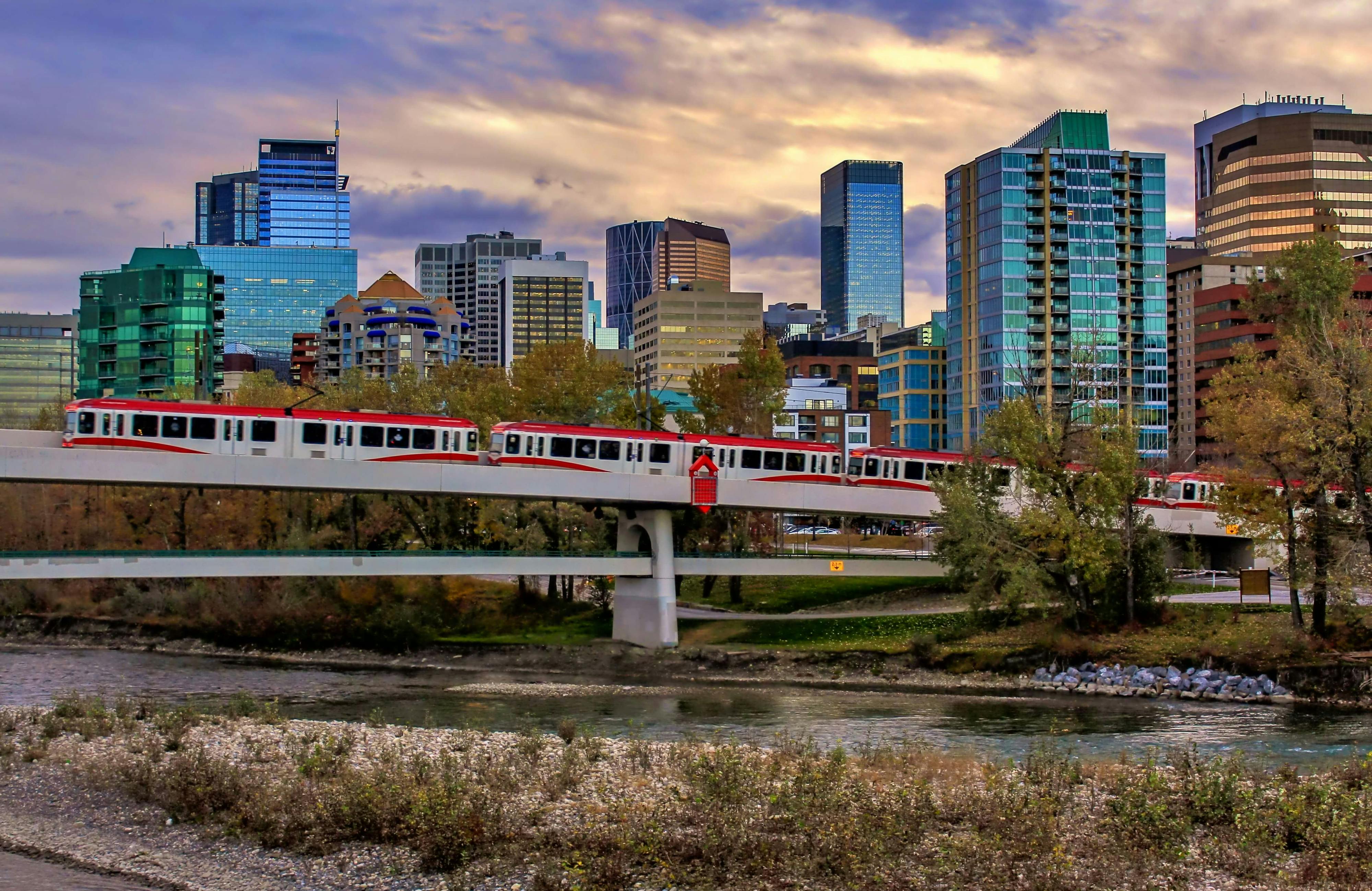 Train crossing a bridge into Calgary