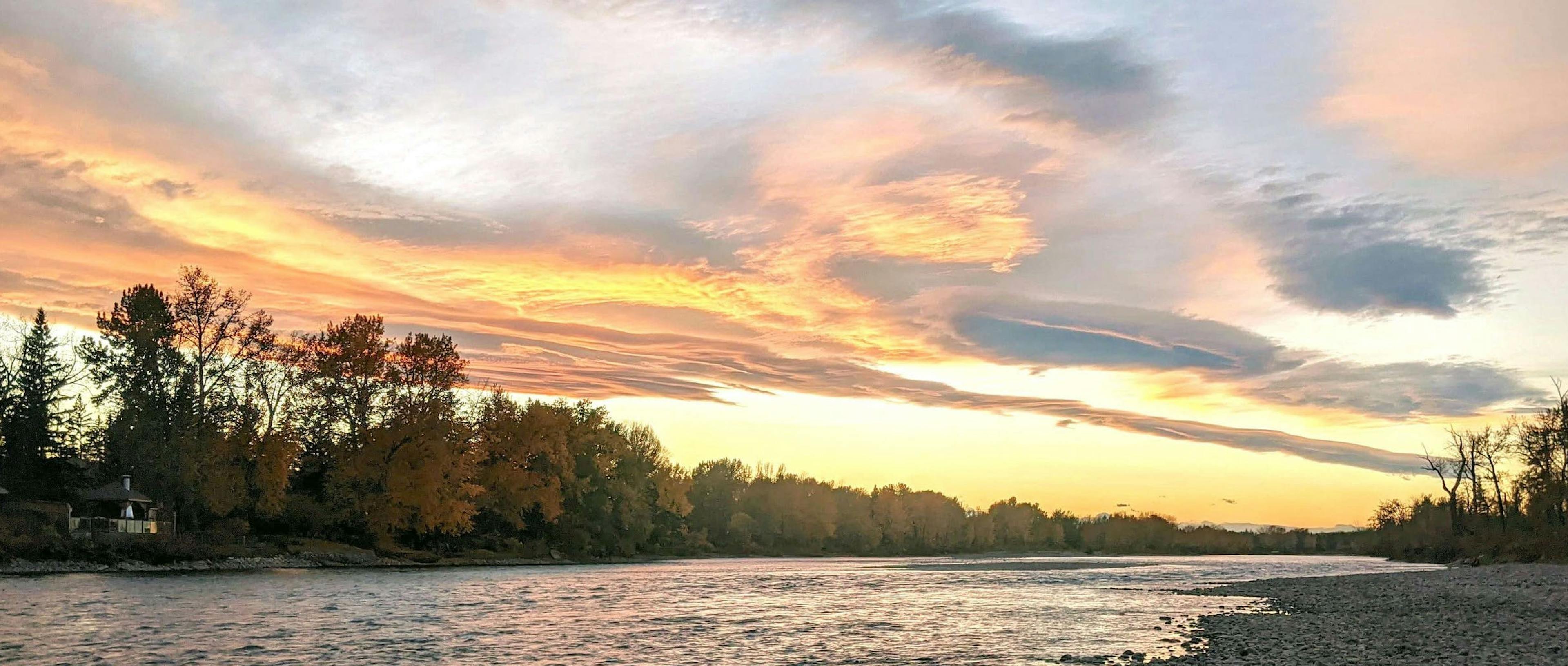 House by the river at sunset