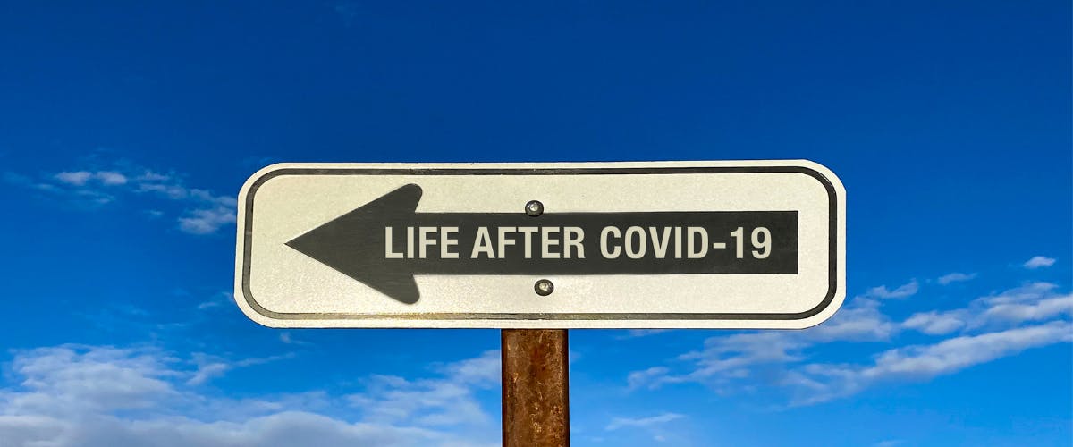 Sign with the word life after Covid-19 and an arrow pointing left