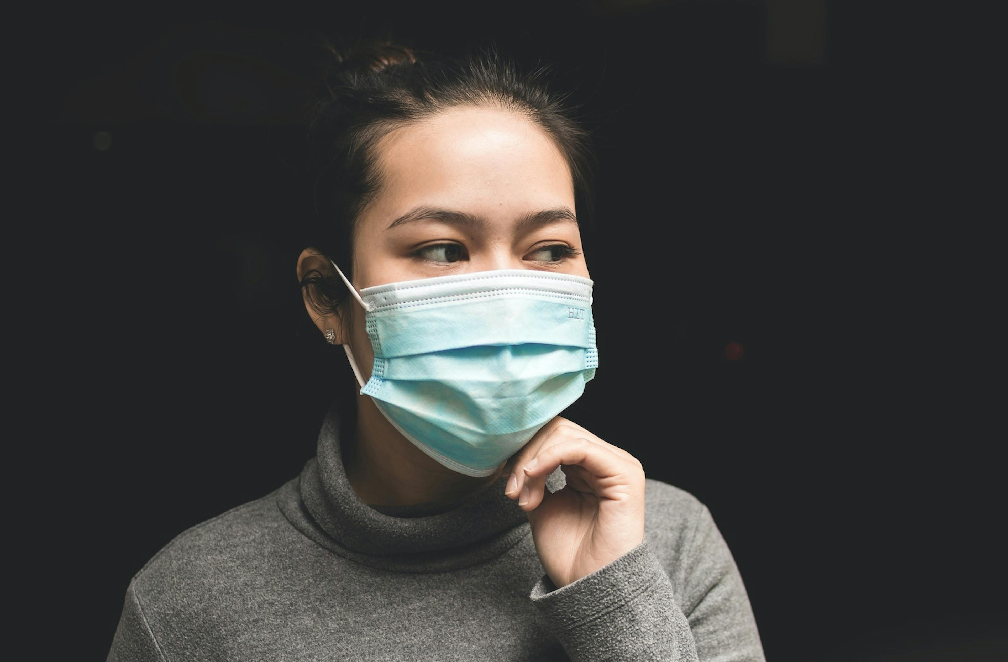 A woman wearing a mask