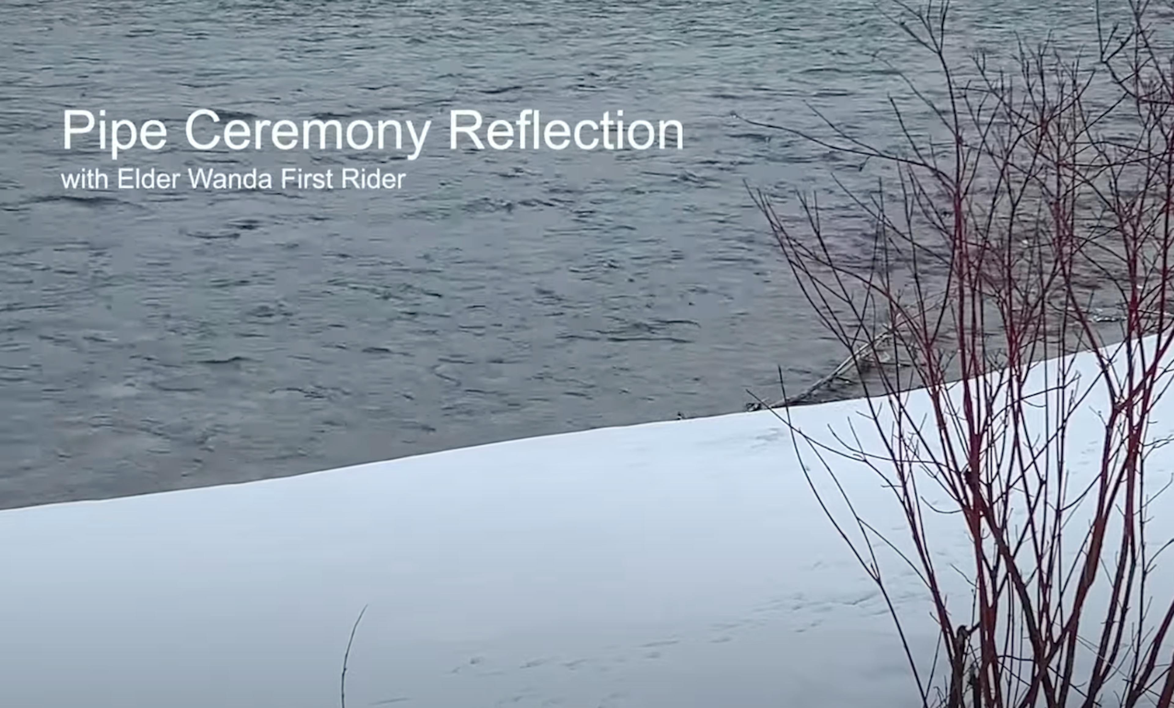Snow-covered riverbank with barren red-twigged bushes against rippling water. Text reads: "Pipe Ceremony Reflection with Elder Wanda First Rider." Calm, serene scene.