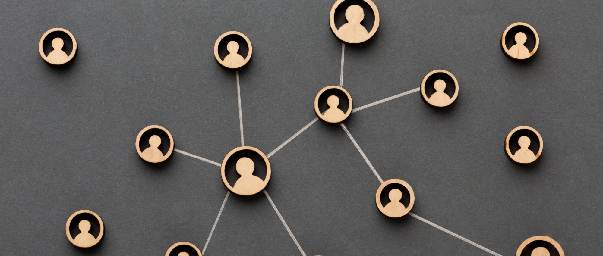 A network of individuals linked by lines, symbolizing connection and collaboration among a diverse group.