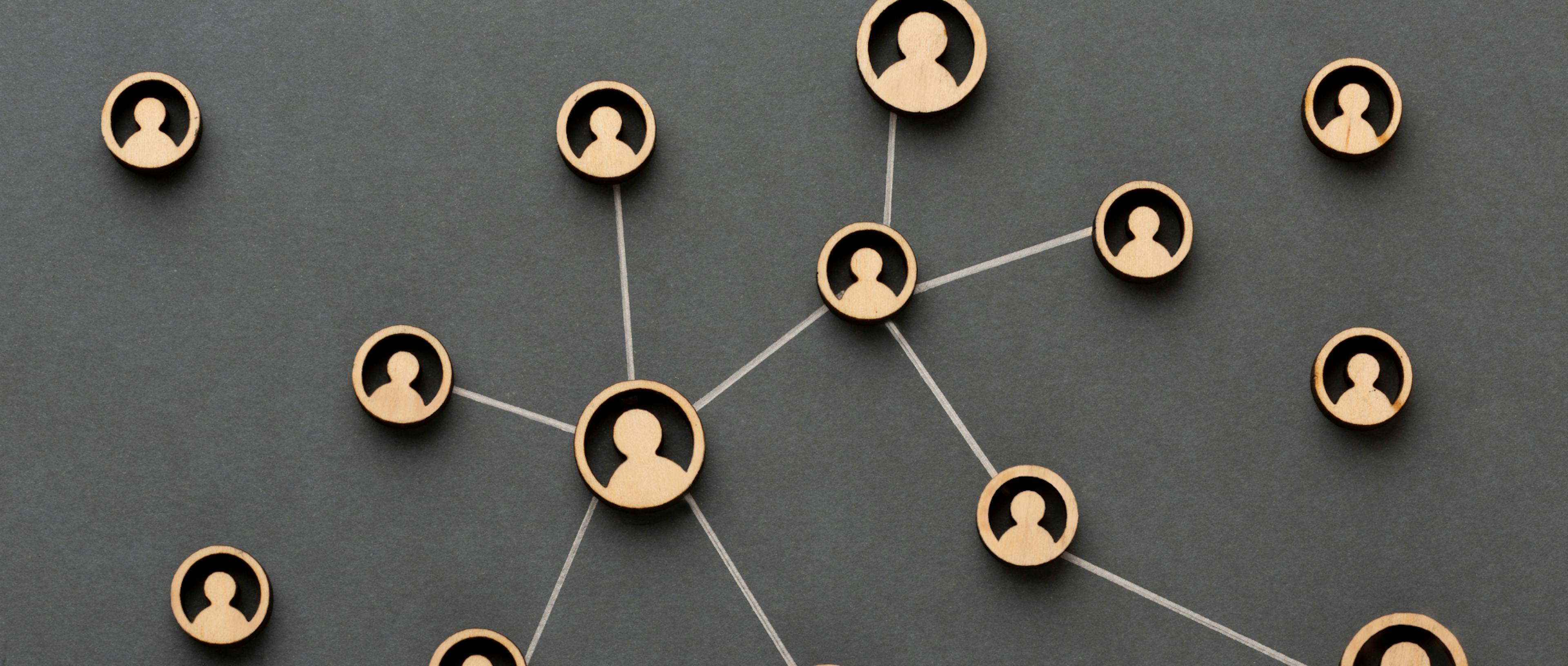 A network of individuals linked by lines, symbolizing connection and collaboration among a diverse group.