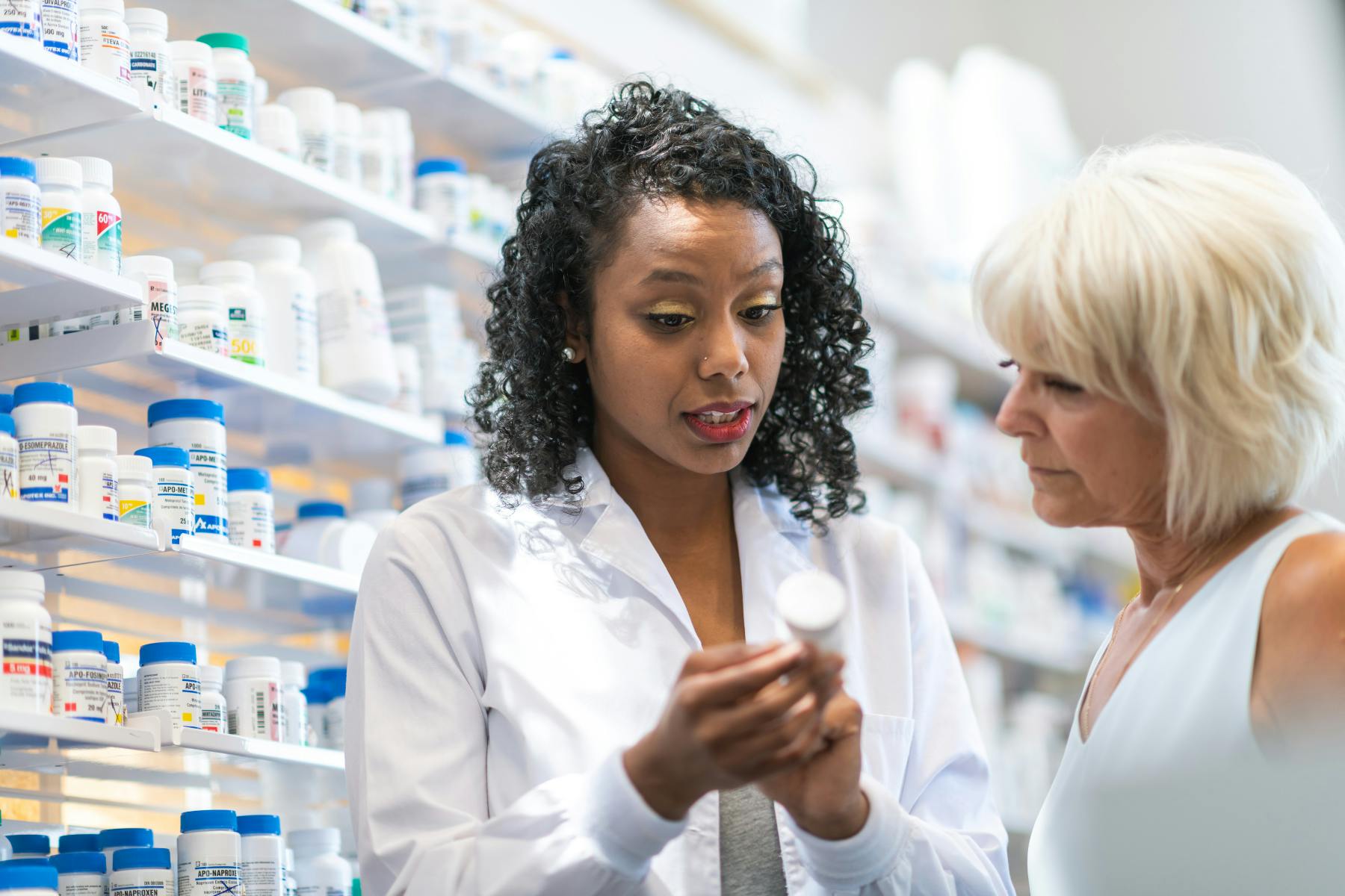 A pharmacist consulting with a patient