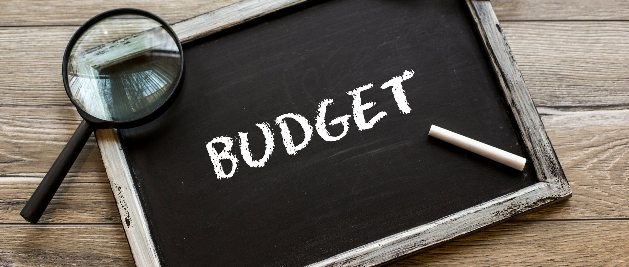 A chalkboard with budget written on it