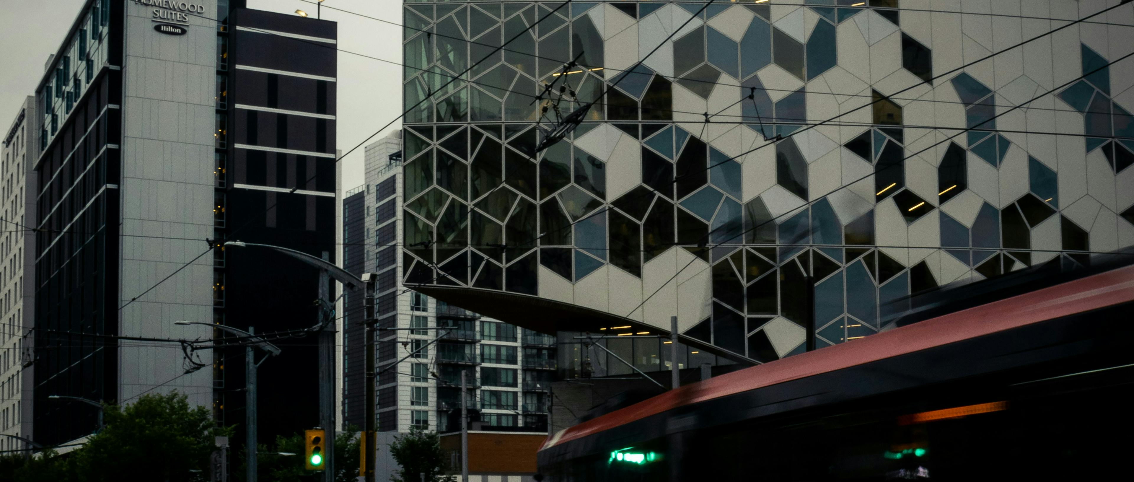A C-train zooms past the Central Library