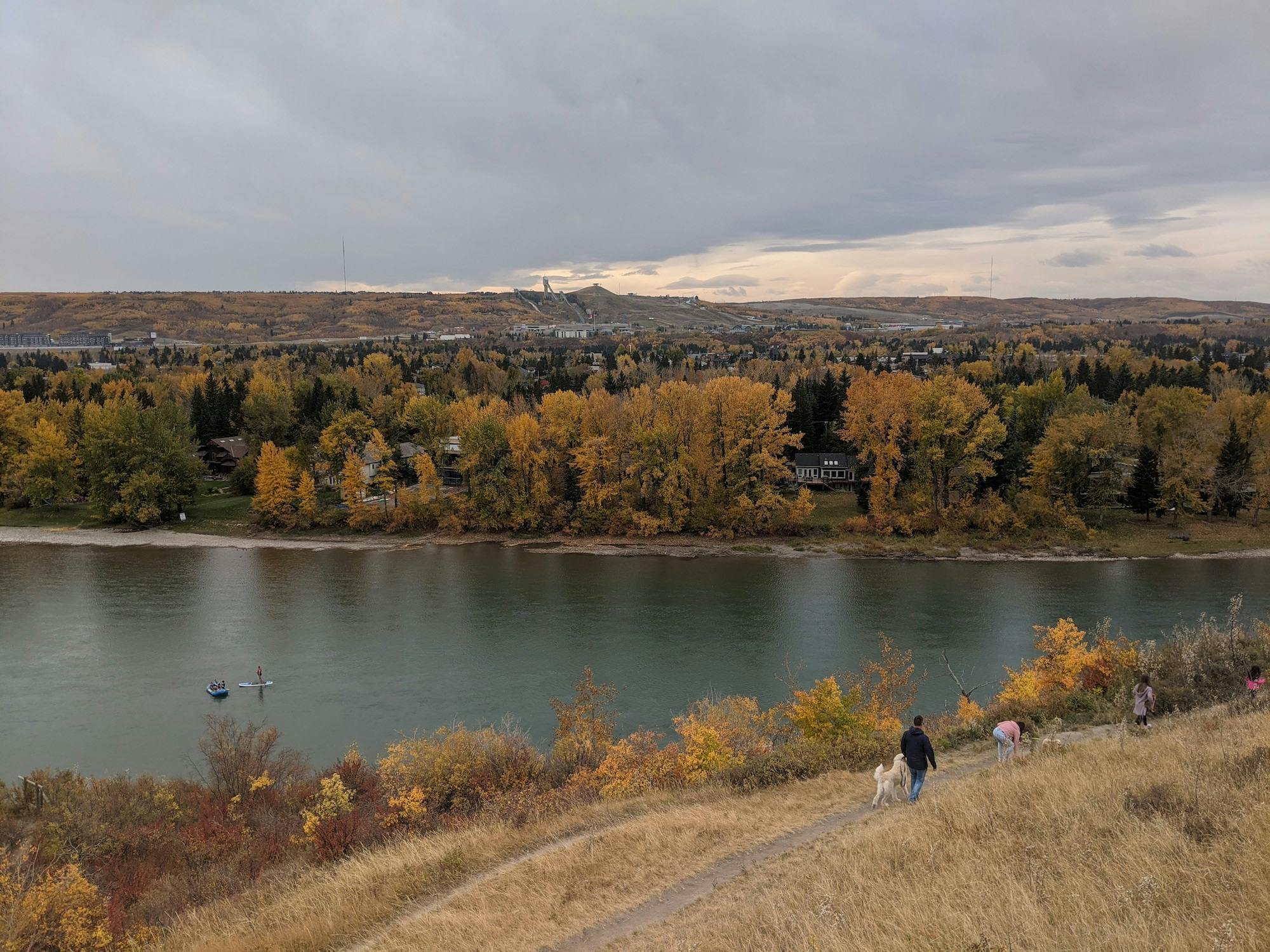 An autumn hillside next to a lake