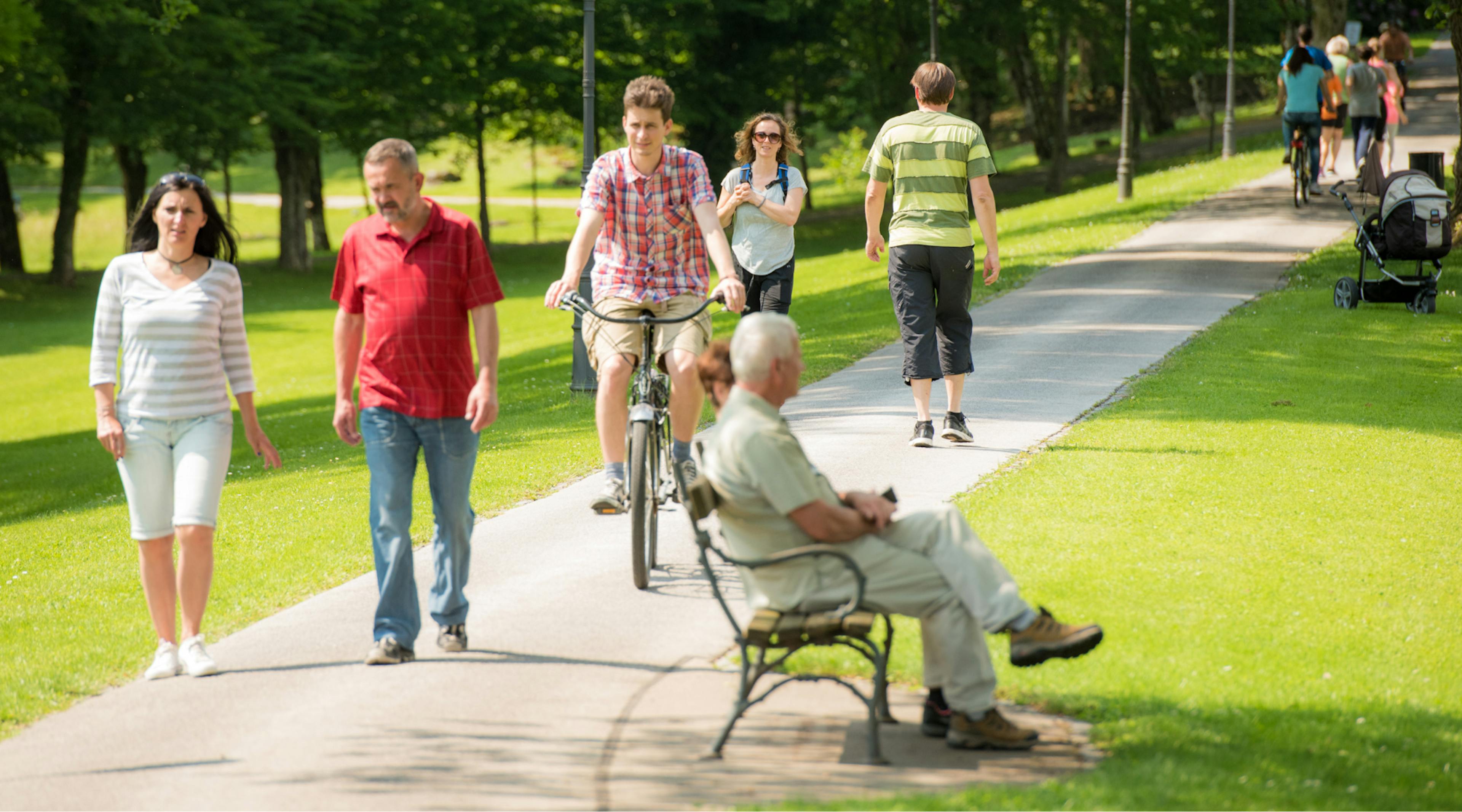 People walking and sitting in a park in Calgary