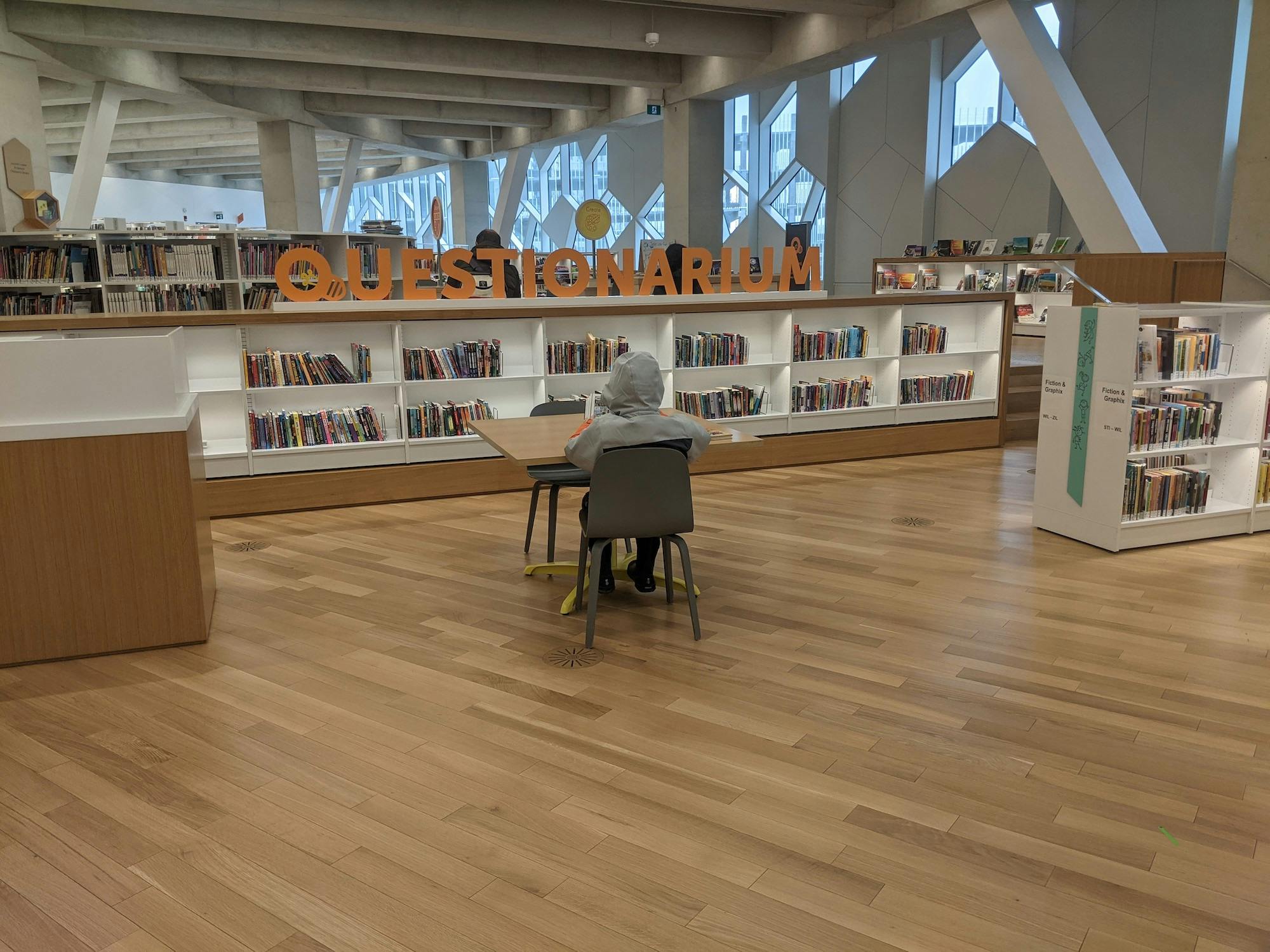 Child sitting in chair in Calgary Central Library