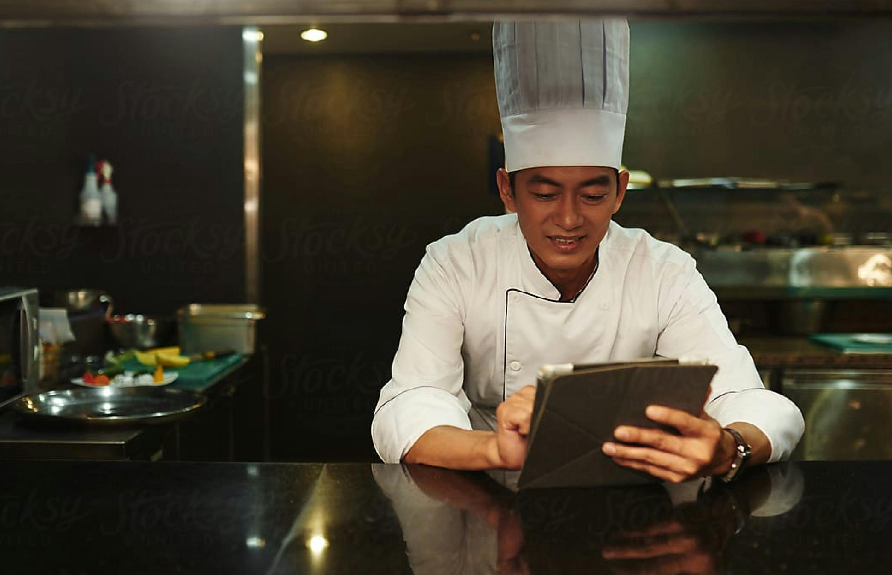 chef-using-an-ipad-in-a-cloud-kitchen-smartcitykitchens-singapore