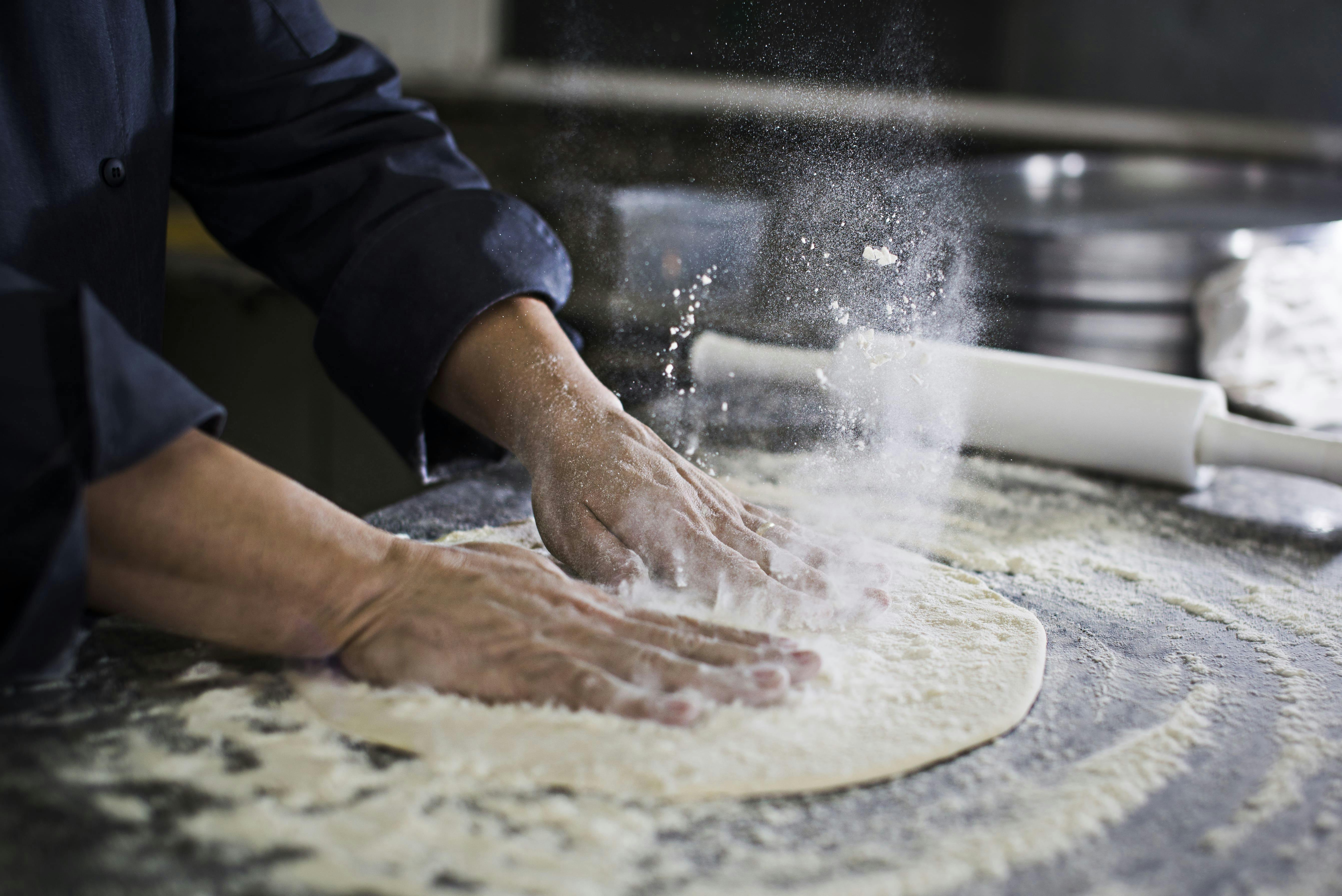 Preparing food in a commercial kitchen at Foodstars Manchester