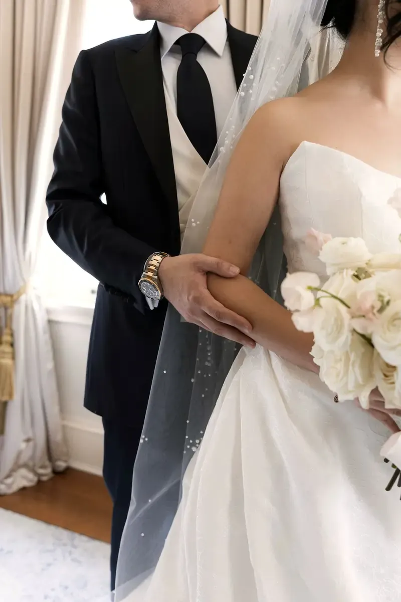 Detail of Dominic’s custom Enzo Custom suit and bouquet