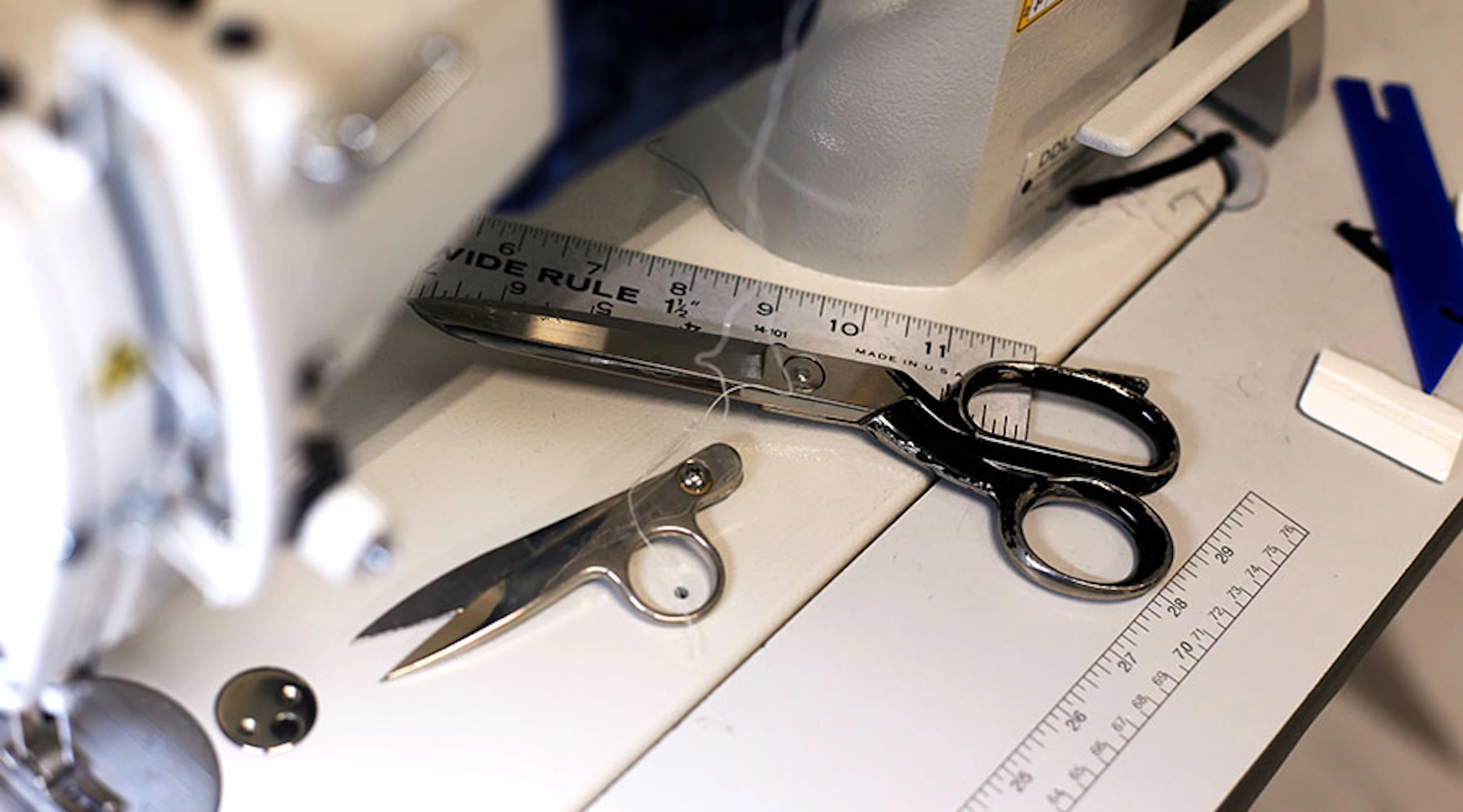 Sewing machine with shears and rulers