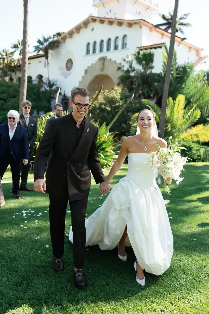 Owen and Alexa walking joyfully after the ceremony, Santa Barbara Courthouse