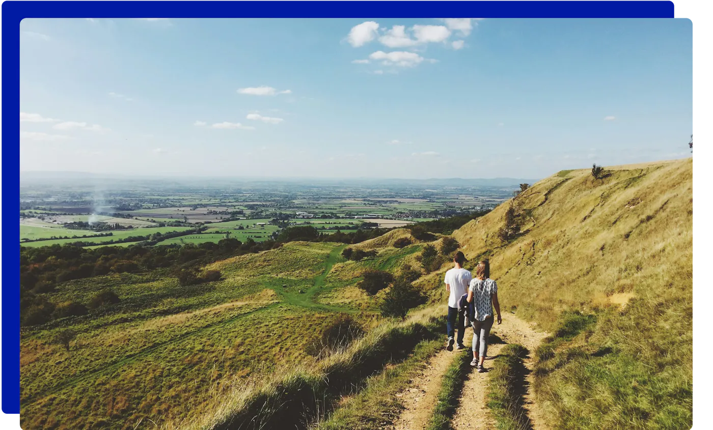 Walkers on the Cotswold Way near Cheltenham in Gloucestershire