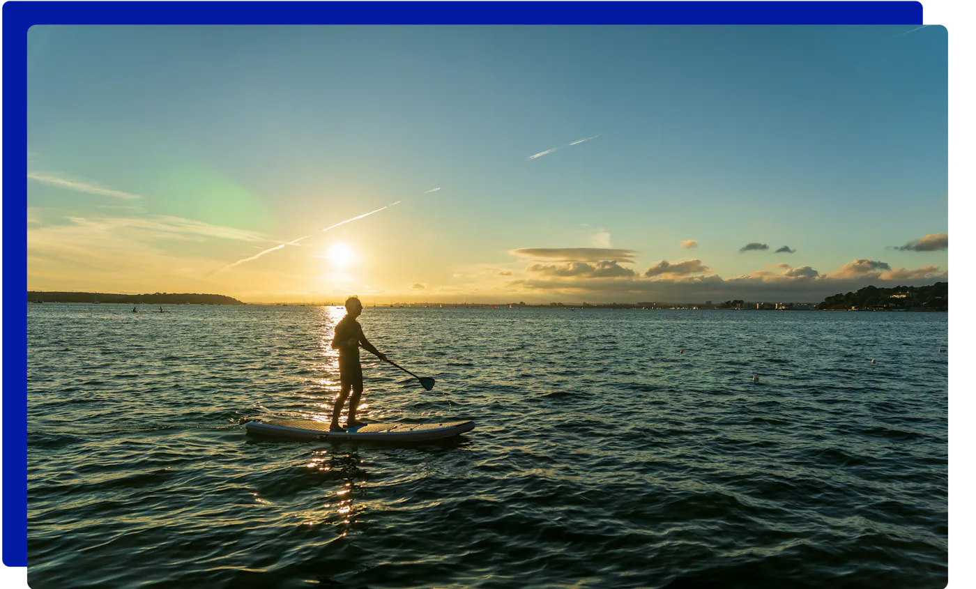 Paddleboarding at sunset at Sandbanks, Poole