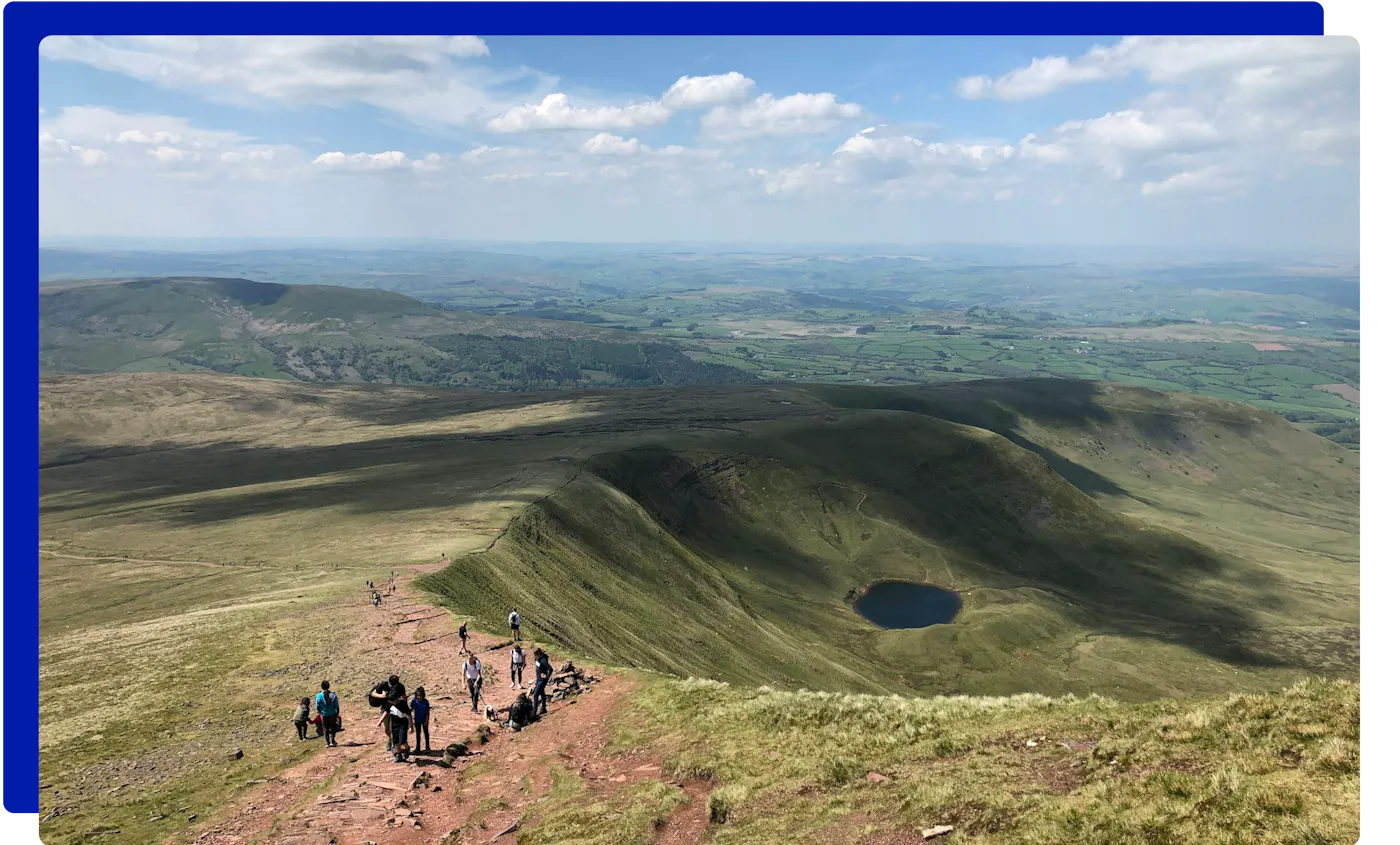 Walkers on the Pen y Fan ridge in the Brecon Beacons (Bannau Brycheiniog)