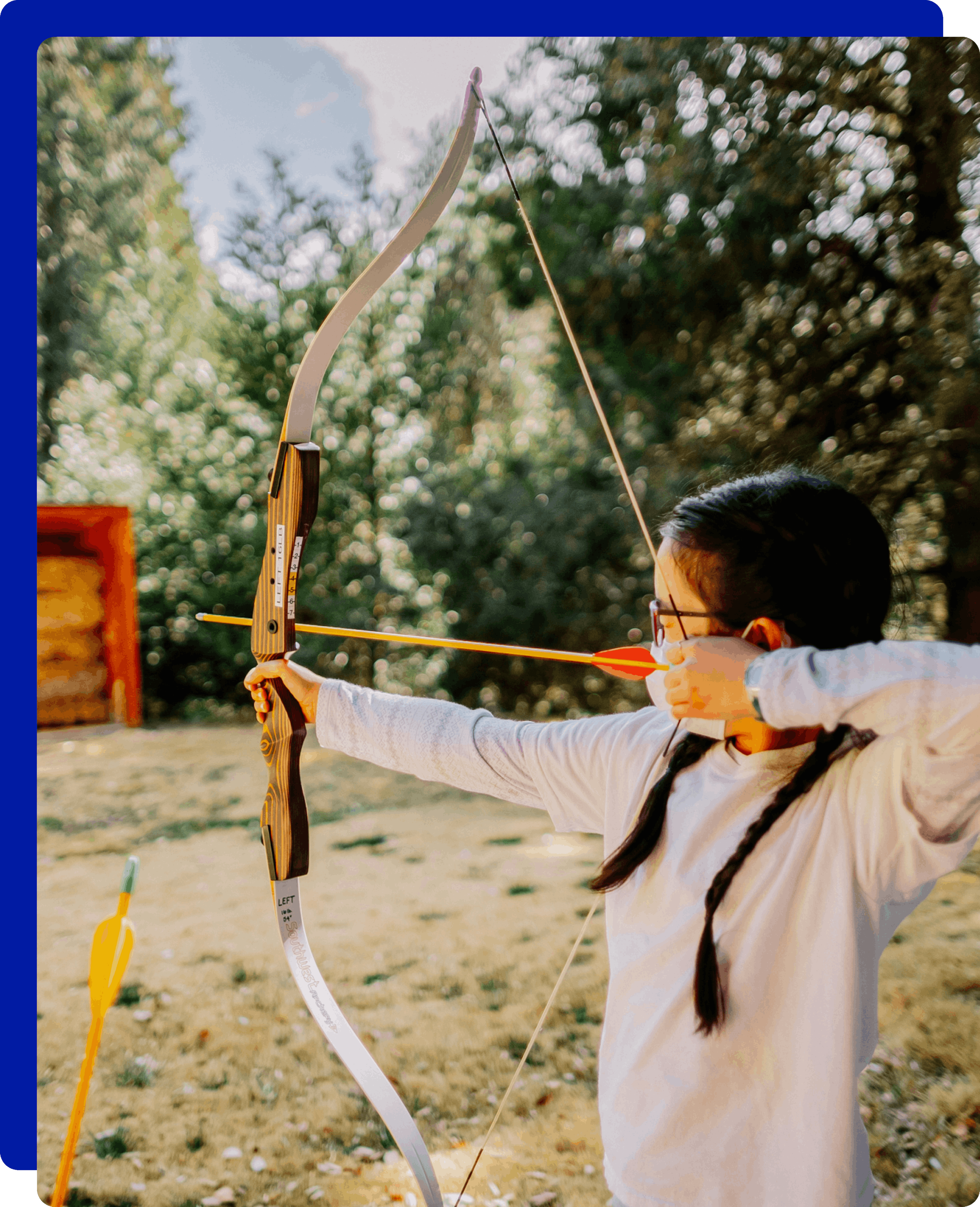 little girl doing archery